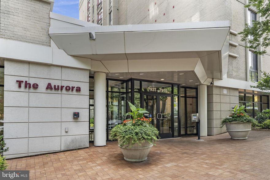 SUNDAY OPEN HOUSE CANCELLED.  PROPERTY UNDER CONTRACT.   The lowest priced 2 BR/2 full bath available in vibrant downtown Silver Spring.  Over 1000 sq feet!     New wide plank honeytone floors throughout.  This home is unique... it comes with a "primo" assigned garage parking spot.  The kitchen features stainless appliances including a gas stove.  It has been upgraded with new contemporary lighting, painted white cabinets, new hardware and a ceramic penny tile back splash.  You will appreciate the special wrap around granite countertop and breakfast bar with dedicated space for keys, mail, and charging station.  
Another rarity....the spacious bedrooms are situated on opposite ends of the home which is ideal for privacy and/or roommates.  Bedroom #1 has an ensuite with huge sink top and walk in shower.  You'll also be spoiled with the largest walk in closet in the building.  Bedroom #2 has a full bath and laundry right next to it.   The living room, with floor to ceiling windows and a juliet balcony, looks out to a courtyard view.  Aurora amenities include a fitness center, social room, courtyard and packages delivered right to your door!  All of this in a PET FRIENDLY and FHA APPROVED community