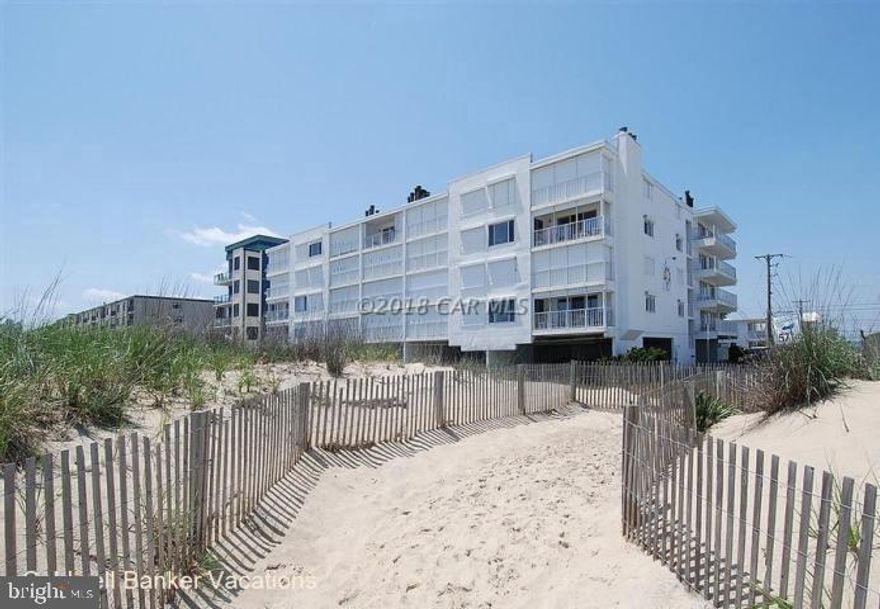 As good as it gets! Exceptional, elevated 2nd floor corner unit with dramatic views out and down the beach. Small, 24 unit mid-rise building. Lovingly renovated with newer kitchen, HVAC system, appliances, HWH, etc. Large floor-plan. Quality furnishings. Outdoor pool. Electric, hurricane storm shutters. Owner'storage locker for beach goods.  Building has just been painted and looks great!  No assessments.  This unit generates about $48,000 every year in income, but you'd never guess it has been a rental. Two covered spaces PLUS extra parking!  Association owns an additional parking lot on the street.  Includes AHS one year home warranty.  Per condo association, all unit woodburning fireplaces in building are not to be used at present until inspected.  Can be shown Saturdays from 10-3.
