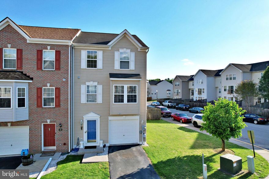 This end-unit townhome in the desirable County Green neighborhood offers space, convenience, and a welcoming community atmosphere. Built in 2004 and offering approximately 2,340 square feet, this 3-bedroom, 2.5-bath home features a well-designed layout across three finished levels.

The entry level includes a one-car garage with interior access, along with laundry and additional storage space. Seller to provide a $2500 allowance for flooring on the lower entry level. Hardwood flooring flows throughout the main level, showcasing an island kitchen with a bright bay-window dining area, a spacious living room with a second bay window, a convenient half bath, and a cozy family room with a gas fireplace.

Upstairs, the expansive primary suite features vaulted ceilings, abundant natural light, and a private bath with double vanity, soaking tub, and separate walk-in shower. Two additional bedrooms and a full hall bath complete the upper level.

Enjoy outdoor living with a fenced backyard for added privacy. The neighborhood tot lot is located just across the street, and the home is ideally situated near commuter routes US-340 and WV-9, providing easy access to Harpers Ferry, Martinsburg, and Northern Virginia.
