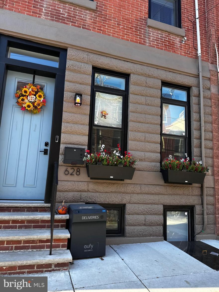 Luxury living awaits in this fully renovated 3-story Graduate Hospital brownstone with nearby garage parking (1 year pre-paid) in the Greenfield Catchment with 8 Years left on the tax abatement. Boasting 5 bedrooms, 3 full bathrooms (2 en-suites), and 2 half bathrooms across (a bathroom on every floor) and approximately 3,367 square feet, this home offers an open floor plan with 10+ ft. ceilings and wide plank white oak floors. The gourmet kitchen features white shaker cabinets, two-tone gray quartz and white marble countertops, and Bertazzoni commercial-grade stainless appliances. Oversized sliding glass doors lead to the private, fenced-in backyard with low-maintenance composite decking, while the fully finished basement provides versatile living options. The second floor includes two well-appointed bedrooms and 2 full baths, with the third floor dedicated to the primary bedroom and bath. Custom closets and storage were all added. The bright and sunny pilothouse leads to the bi-level roof deck with panoramic Center City skyline views and low-maintenance composite decking. New systems as of 2022, a 10-year tax abatement with 8 years left, and a convenient location near Center City, the University of Pennsylvania, and public transit make this home the ultimate in-city living.

As an added amenity to the purchase of the property, the seller will offer a complimentary one-year pass to the nearby South Street Parking Garage. This secured and covered facility is accessible 24 hours.

This facility currently has a yearlong wait list and charges new members $350 per month to secure access.

All square footage numbers are approximate and all square footage in these homes are above grade!. Square footage should be verified by the buyer. It is the responsibility of the buyer to verify real estate taxes. Taxes are estimated.