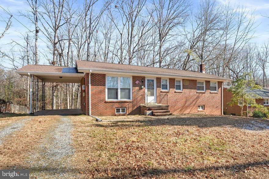 SOLD STRICTLY AS-IS. This charming rambler located in Ferry Farms in south Stafford, VA presents a unique investment opportunity. Built in 1960, this brick home boasts a traditional floor plan that maximizes space and functionality. With 1,075 finished square feet, the layout includes three cozy bedrooms and a full bathroom featuring a tub shower. The inviting kitchen offers ample table space, ideal for casual dining and entertaining. The combination kitchen/dining area enhances the home's warmth, making it a welcoming hub for gatherings. While the property requires major rehabilitation, this presents a blank canvas for investors to add value through renovations and updates, potentially increasing rental income and property appreciation. The unfinished basement with a walkout level provides additional space for expansion or storage, further enhancing the property's appeal. An attached carport and driveway ensure convenient parking. Located within 5.5 miles of a commuter rail station, this home is perfectly positioned for those commuting. With its solid structure and prime location, this property is a promising investment. Embrace the potential and transform this house into a beloved home.