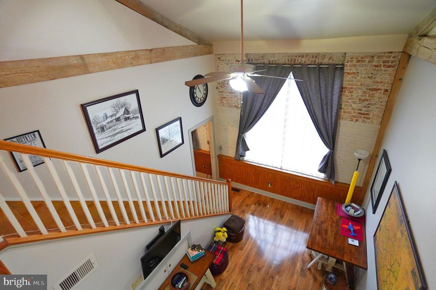 Beautiful condominium in Gettysburg borough within walking distance to downtown and convenient to shopping and restaurants. Lots of natural light shines through the oversized windows to highlight this open interior with cathedral ceilings and an upper-level balcony. Main level bedroom with huge walk-in closet and laundry area. Second story loft suitable for 2nd bedroom or office area. Condo is completely furnished and includes all appliances, including washer/dryer combo, furniture. Reasonable $150/mo condo fee includes all exterior and common area maintenance. Reserved parking space; sizeable, dedicated storage area available in basement.