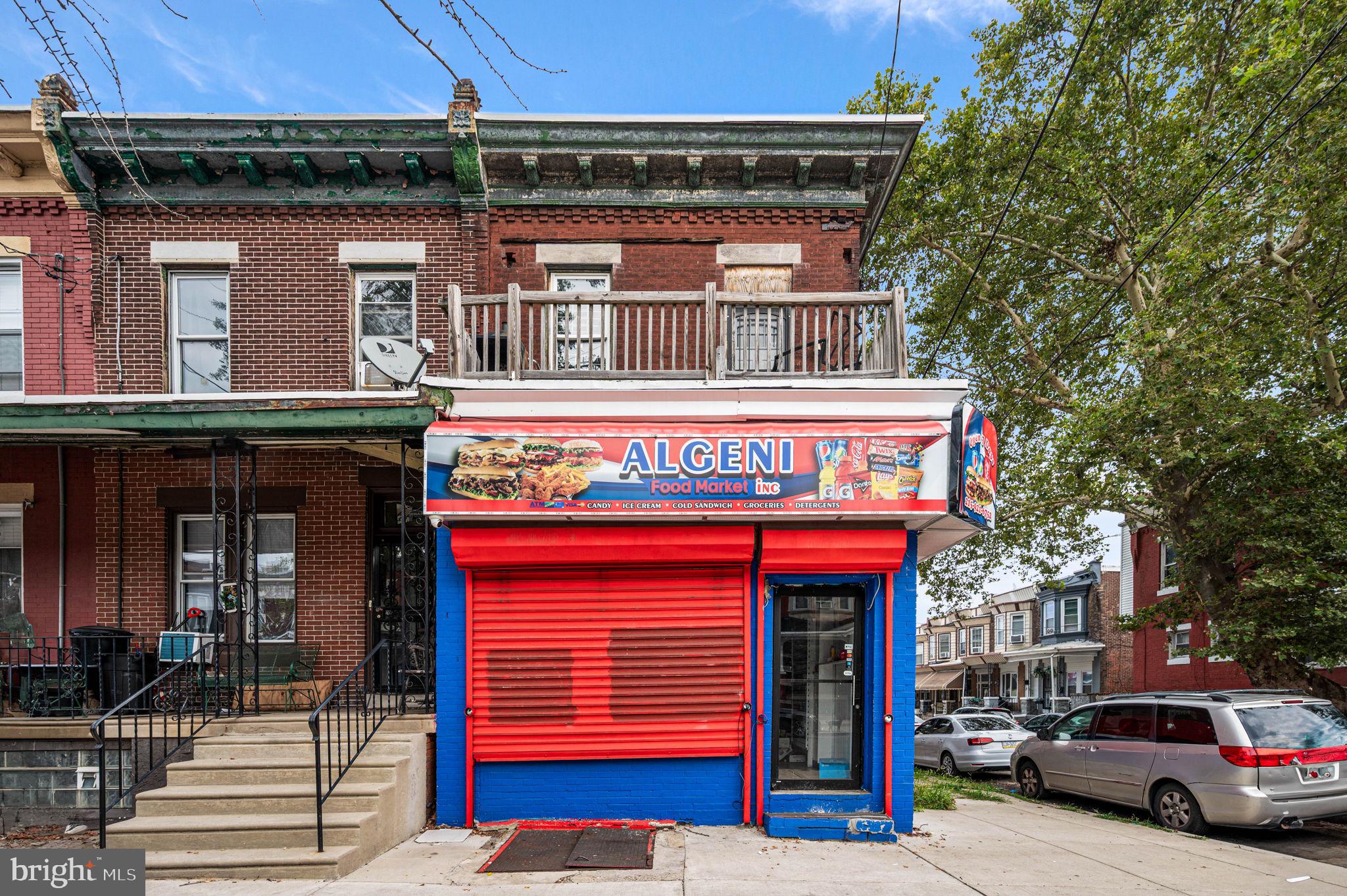 This versatile property with commercial mixed-use zoning features a storefront currently set up for a convenience store, plus two residential units. The unfinished residential unit is located on the first floor behind the store, offering potential for added rental income or customization. Upstairs, you'll find a large owner-occupied 1-bedroom unit with the versatility to be converted into a 2-bedroom. A great opportunity for investors or owner-users to maximize both commercial and residential value.
Buyers are encouraged to perform their own due diligence regarding permitted business uses.