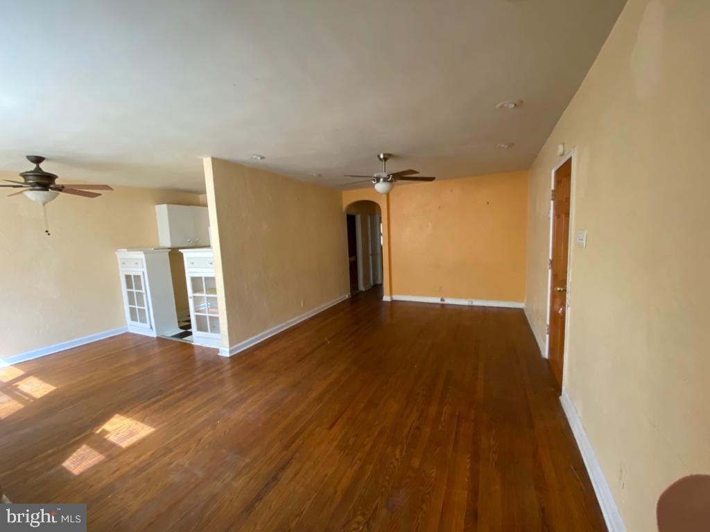 Spacious 2 bedroom, 1 bath apartment! Large open living/dining room - hardwood flooring throughout. Ceiling fans, large bedroom closets! $75 monthly water fee will cover all cold water usage. Coin-operated laundry on site. One off street parking space included! Very large shared courtyard in front of property. Additional garages available for an additional fee. Tenants are responsible for all utilities. Convenient location. Schools, shopping, recreation and transportation all within walking distance. First, last, and security deposit required to move-in.