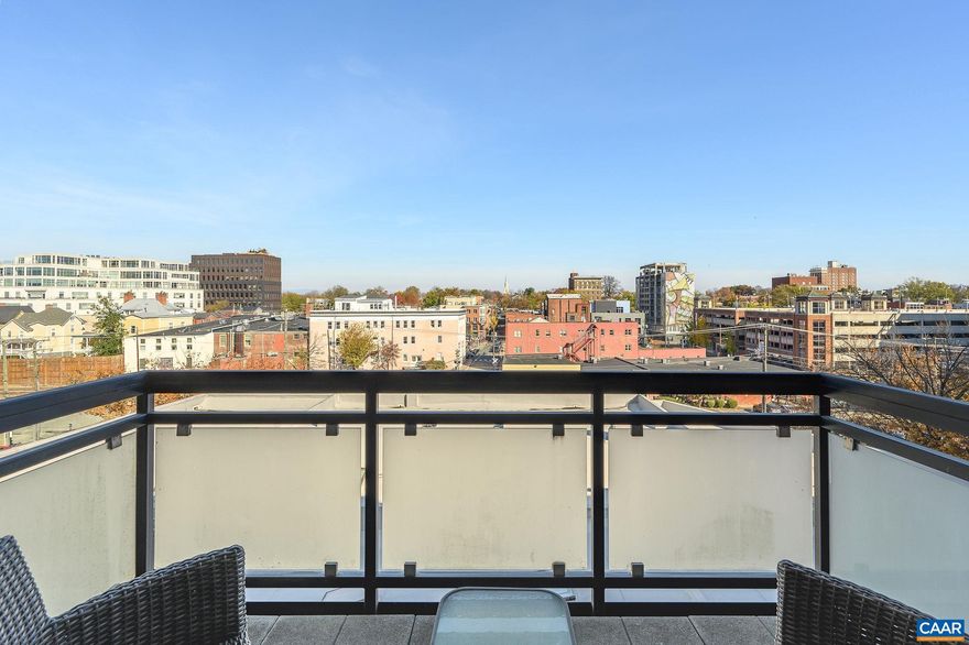 Perched on the 5th floor of The Gleason, this light-filled one-bedroom condominium offers elevated north-facing views across downtown Charlottesville and toward the Blue Ridge beyond. Large windows and an open floor plan create a sense of space that lives comfortably beyond its 865 finished square feet, with seamless flow between the kitchen, dining, and living areas. The kitchen features granite countertops, stainless appliances, warm wood cabinetry, and breakfast bar seating, opening to the main living space with hardwood floors throughout. Step onto the private balcony to take in the cityscape and mountain backdrop?an ideal extension of the living area. The bedroom is generously sized and complemented by a full bath and separate laundry space. The Gleason is a secure, elevator-served building two blocks from the Downtown Mall, with convenient access to restaurants, markets, performance venues, ACAC, and UVA. Reserved covered garage parking and dedicated storage complete this turnkey downtown offering.,Granite Counter,Wood Cabinets