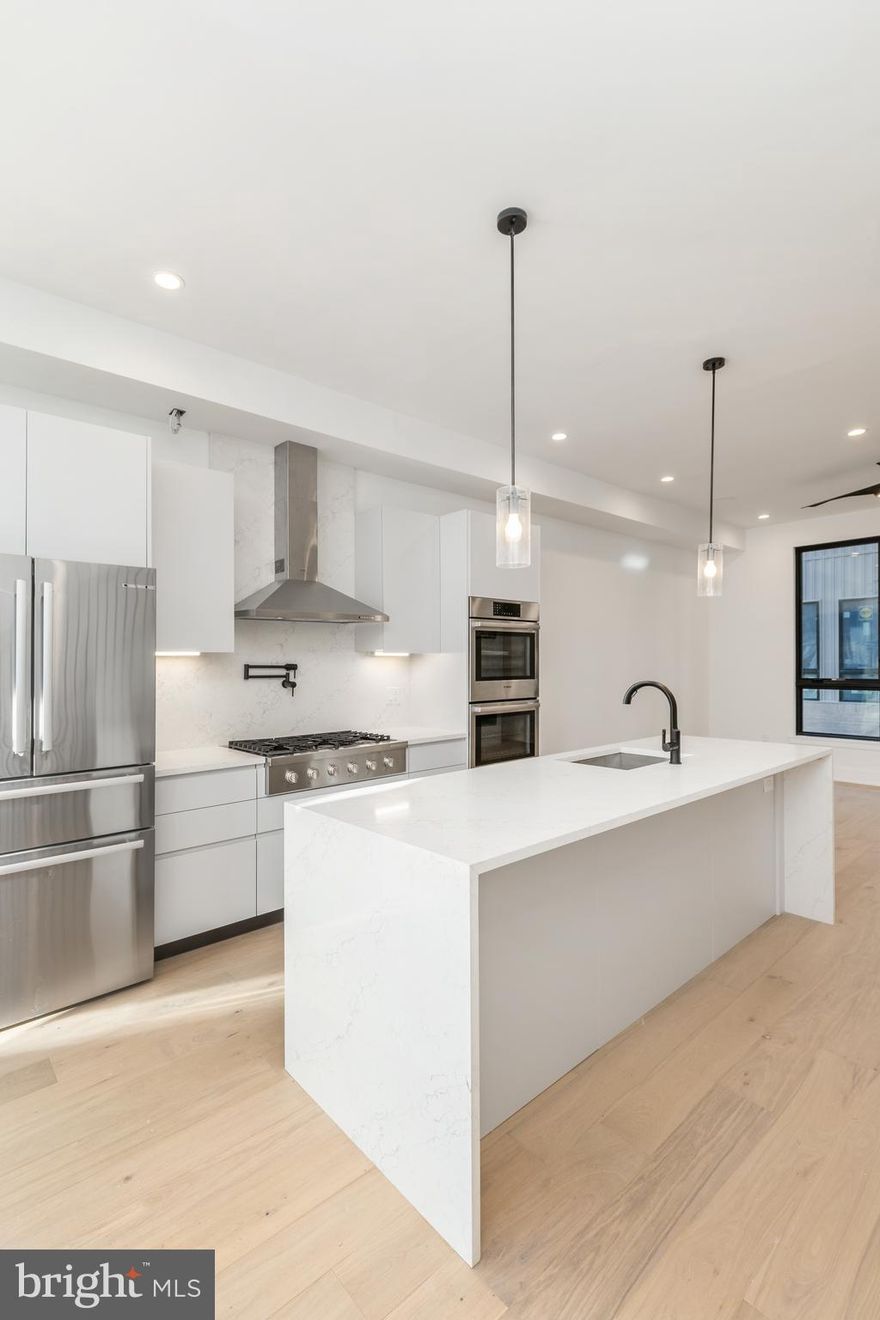 Extra large, new home at Artist Village, Philadelphia's brand new community of spectacular stately residences. With its prominent location at 17th & Bainbridge Streets in the heart of the historic Graduate Hospital, this unique enclave of homes will transform an entire city, bringing new life to a treasured neighborhood. Developed by The Regis Group & Ingerman Company, the first phase of Artist Village offers twelve luxury townhomes running parallel down 17th St and Colorado St. Each residence has been expertly designed, by JKRP Architects, with a layout that perfectly blends form with function. Every home will have private 1-2 car garage parking, an expansive roof deck - three outdoor spaces total, a tax abatement, elevators in the 17th Street homes and smart-home technology throughout plus the homes on 17th Street each have an elevator! A handsome brick facade greets you at the home's exterior. Once inside, you'll discover a completely open main level with a living room and dining area filled with natural light from tall windows. The stunning chef's kitchen, adorned with top-of-the-line appliances, custom cabinetry, and designer finishes, is sure to become the heart of the home! The lower level has the all-important 1-2 car garage parking and a bonus space ideal for a home theater, playroom, or gym. The second level has two bright bedrooms, two full bathrooms, and a conveniently located laundry closet. The primary suit covers the entire third level, acting as a private retreat. There's a large bedroom with great natural light, a custom walk-in closet with space to share, and a luxurious bathroom fitted with a double vanity, soaking tub, rainfall shower, and a water closet. Topping off this amazing home is a one-of-a-kind bi-level roof deck! With a powder room and wet bar equipped pilot house, tons of space to spread out, and mesmerizing views of the city, this is an entertainer's paradise! Not only is Artist Village a fantastic development, it's in an equally fantastic neighborhood. This highly sought-after Graduate Hospital location earns a WalkScore of 97! Nearby, South Street is lined with local restaurants, shops, and markets. Fine dining, luxury shopping, and lively entertainment can be found in neighboring Rittenhouse Sq, plus Target, Sprouts Farmers Market, and Wine & Spirits are less than a 10-minute walk. This central location also provides easy access to Broad St, Washington Ave, Jefferson Hospital, Pennsylvania Hospital, University City, and I-76. Artist Village presents a rare opportunity not to be missed. The time is now to reserve your home, customize your finishes, and plant your roots in Graduate Hospital's next chapter. The top floor flex space can easily be converted into a fourth bedroom; a door can be added for privacy. Taxes and square footage are the responsibility of the buyer to have verified. Association fees are TBD. *Photos are of a similar home in the development. Photos/renderings are for marketing purposes only and may not portray actual finishes.