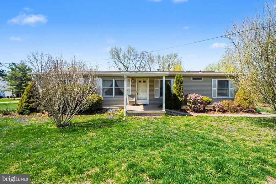 Welcome to this charming 3-bedroom, 2-full bath modular ranch situated on a desirable corner lot. The open dining room flows into a functional kitchen, complemented by a spacious living room. The primary suite features a private en-suite bath, along with two additional bedrooms, and a convenient first-floor laundry area. A full walk-out basement offers ample storage or potential for future finishing. Additional highlights include 200-amp electric service, central air, a covered rear deck with storage below, and plenty of off-street parking. All appliances are included.  Schedule your showing today!