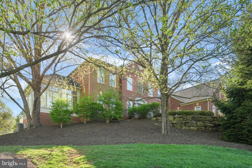 Thank you for your interest. Exceptional Great Falls estate is set across approximately two acres of beautifully composed grounds, offering nearly 8,900 square feet of refined, resort-inspired living.  A graceful approach along a flagstone and brick walkway leads to the brick porch and front door with sidelights. Inside, a double staircase creates a striking architectural moment, while natural light draws your eye through the home to the surrounding landscape. Rich color and texture throughout offer a refreshing departure from the expected neutral.  Designed for comfortable daily living and entertaining on most any scale. The dining room is unforgettable, enveloped in panoramic countryside scenes in the classic papier peint panoramique tradition, accented by a gold leaf ceiling and crystal chandelier, with seating for 14+. A series of beautifully scaled spaces, including a music room, sunroom, den, and expansive family room—flow seamlessly, grounded by hardwood flooring. Each of the five bedrooms offers a private, fully renovated en-suite bath and walk-in closet with custom organization. Four bedrooms feature hardwood flooring, reinforcing the home’s consistent level of finish. The primary suite is a true retreat. A private sitting room and dressing room lead to a spa-caliber bath featuring heated floors, motorized blinds, lighted mirrors, a soaking tub, and an oversized walk-in shower. The custom closet is extraordinary. Meticulously designed with bespoke cabinetry, specialized jewelry storage, integrated lighting, and tailored wardrobe systems. It is as functional as it is beautiful. The kitchen is both refined and inviting, equipped with Sub-Zero refrigeration and a Wolf six-burner range with griddle and double oven. Open to a casual culinary lounge and sunlit morning room. Private back staircase. Out through French doors to an expansive deck overlooking the grounds. Full laundry room with utility sink. The lower level transforms into a destination of its own. It is an immersive space for recreation and relaxation. Billiards, ping pong, a golf putting green, fitness room, full bar with wine storage, lounge and create a dynamic environment for entertaining. A hidden panel storage room adds intrigue, while an additional bedroom and full bath provide flexibility. Large storage room. Walkout access leads to a stone patio and paver fire pit patio, surrounded by lush landscaping and wide, peaceful views. Roof 2024, HVAC 2026, Major renovation 2023, New asphalt driveway 4/2026. Set on a commanding lot in one of Great Falls’ most desirable locations, this home offers a rare combination of scale, privacy, and thoughtful design.