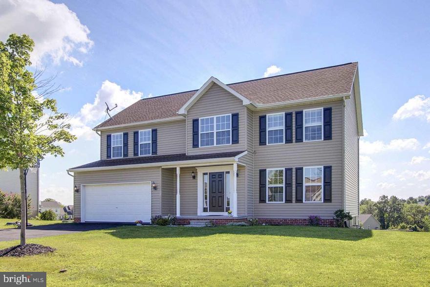 Beautiful spacious newer colonial with 4 bedrooms, 2.5 baths on large level lot.  2 story open foyer. Maintenance free deck. Large master suite with walk in closet and double vanities and sinks.  All kitchen appliances stay.  Fresh paint and new laminate floors in LR, DR and FR. Over 2600 sq. feet of living space...Full basement has outside entrance.  Must see!!