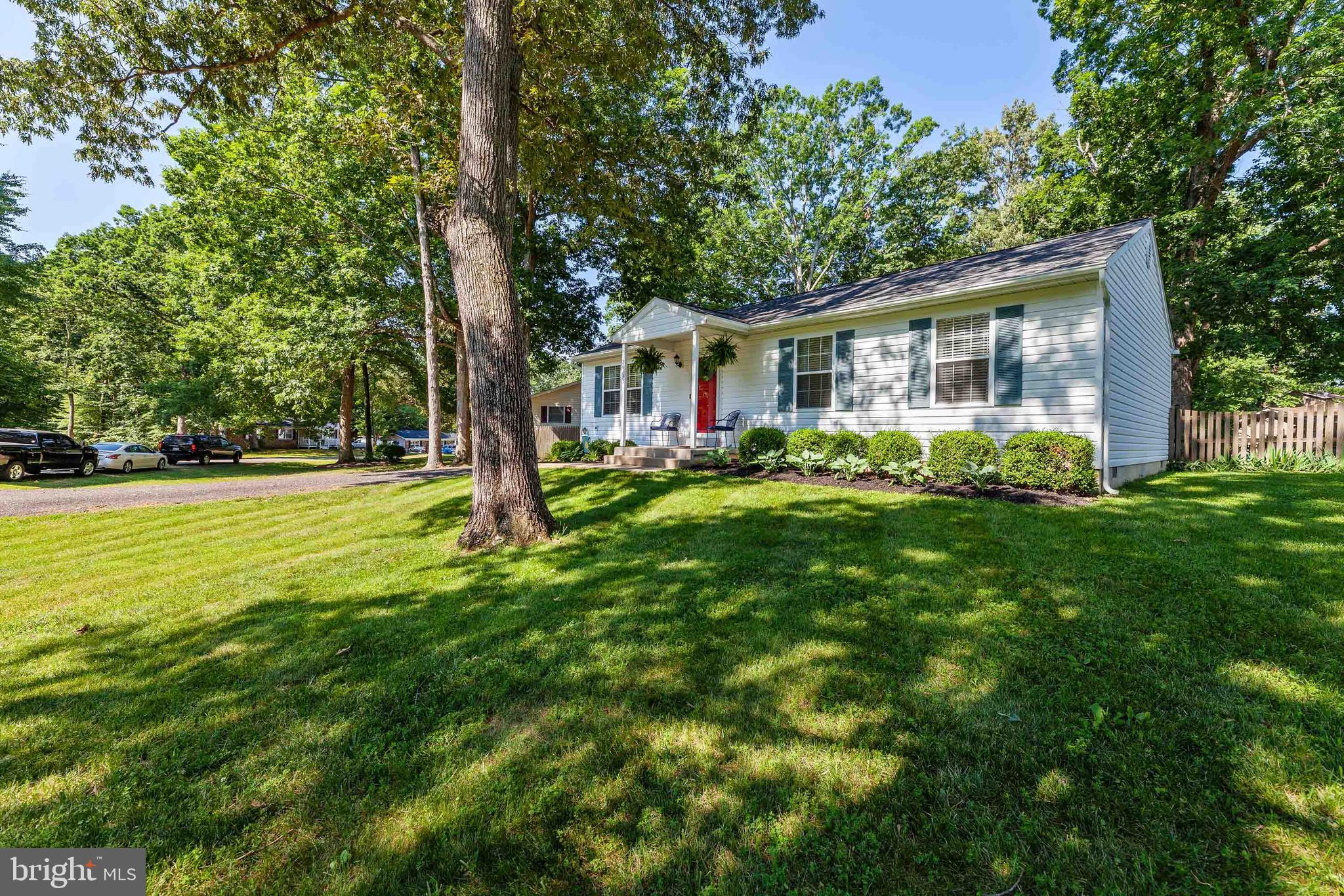 Meticulously maintained, sweetest home on the block- located on a large level lot in Wicomico Shores. This charming home 3 BR, 2FB, offers thoughtful updates inside and out. Interior features beautiful, quality wood laminate flooring, new carpeting, and fresh paint. The kitchen is a stunner with granite counters, subway tile backsplash, stainless steel Samsung appliance suite,large pantry, island with seating and comfortable space for dining table. Deck off kitchen provides great gathering space and overlooks ample, fully fenced level backyard for all your entertaining fun. The oversize shed provide space for tools and toys. Easy access to backyard from double gates off of the extra wide driveway with plenty of parking for cars, trucks, trailers or boats. Enjoy waterfront at the landing with boat ramp & pier, picnic area and playground, 18 rounds on the golf course, or dining at the Riverview Restaurant - all located within the neighborhood. Most recent updates also include new roof (2019) and new hot water heater (2018). Act today!