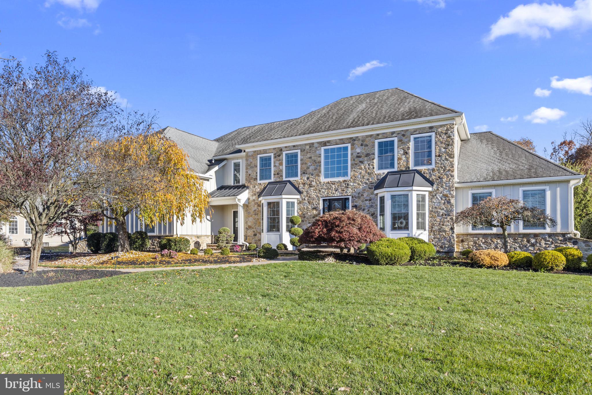 Exquisite six bedroom and six-bathroom Center Hall Colonial in Council Rock School District and residing in the desirable community at Woods of Northampton. This Frankfurt model is the largest at 5,284 square feet and set on 1 acre. Amenities include resort style heated swimming pool with shelf area, slide and fountains. Pool house with changing room and half-bath. Outdoor Gazebo overlooking swimming pool, Trex deck with outdoor kitchen area, and Travertine patio complete the back yard oasis and enclosed with black coated aluminum fencing.
Must see the recent First-Class updates and renovations. Enter home through custom style front door and find two-story foyer with immense wainscoting and decorative moldings throughout first floor, 2nd floor hallway and Master Bedroom. Staircase spindles have been upgraded to wrought iron. Kitchen updated in Summer of 2022 and has Epicurean and gourmet attributes. Top of line stainless steel appliances; two dishwashers, double built-in wall oven with custom warming draw, 6-burner gas stove, shelf microwave, built-in ice maker, and Butler pantry.
3-Gas fireplaces. Built-in Sound System w/music-ceiling speakers in Living room, dining room, kitchen, family room, and conservatory. Recessed lighting throughout entire home.
Additional features include a Conservatory room off living room, office with custom cabinets and shelves, Wine Cellar with temperature control, closets throughout home have built-in organizers and shelf system. Laundry room with newer washer, gas dryer, luxury vinyl flooring, and more cabinetry.
Basement is a walk-out having luxury vinyl flooring, built-in bar area with sink and refrigerator, and lots of storage. Two sump pumps with battery back-up and reverse osmosis system.
Three-car garage with epoxy floor and new Wi-Fi garage door opening system with quiet rails. Whole house Generac generator.
Stucco Removal Summer of 2020 and the front was replaced with Stone, and long-lasting Board and Batten siding while luxury vinyl siding was installed on the other three-sides. Vinyl-Gutters and Soffits were replaced as well. Pella Low-E Glass Windows were all installed in 2020 (Low-E glass has a coating that improves energy efficiency)
Grounds are professionally landscaped and having sprinkler system around the front yard to back yard.