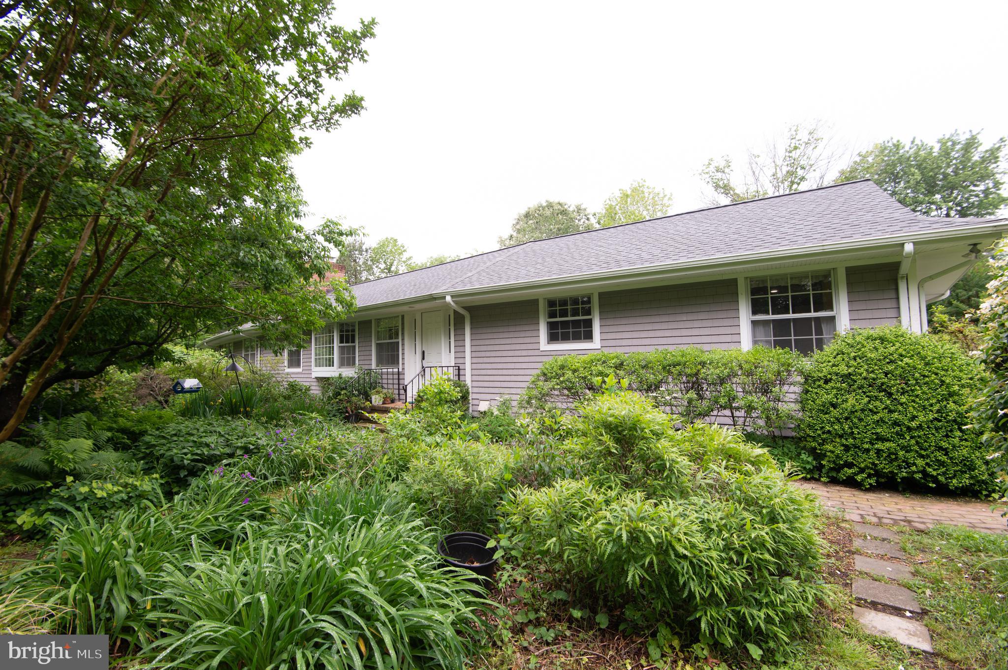 Located near the Talbot Country Club on a corner parcel enjoying 2 acres of remarkable natural habitat, gardens, and a wonderful canopy of trees, this single-floor home has been lovingly cared for with substantial improvements over the years. With approximately 2,800 square feet providing three bedrooms, three baths, an open living & dining area with fireplace, a family room with fireplace, office, utility and sunrooms, a two-car garage with attached wood-working shop and expansive back deck with pergola and spa, this is a most comfortable and convenient floorplan in a desirable location.
Equipped with geothermal heating and cooling, along with a solar array, the residence is extremely efficient to operate. Additional improvements are numerous and include a new roof, encapsulated crawl space, several new appliances to name a few.