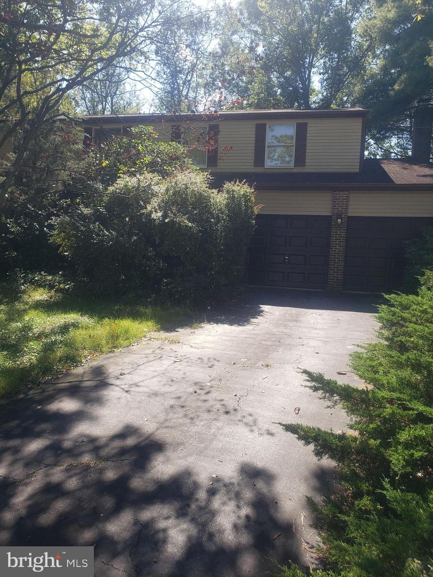 A fantastic opportunity to get the largest Ryan Homes model.  5 large bedrooms upstairs, big living room, dining room, kitchen, family room and large breakfast area all on main level.  Two sliding glass doors to outside, and the three rear decks.  Backs to woods.  Large 2-car garage and driveway.  Huge unfinished. level walkout basement, with potential for a couple more bedrooms, recording studio, second kitchen, bath., in-law suite.  Bring your decorating ideas.  Beautiful lot, needs some trimming of the large bushes and shrubs we know, but a great opportunity to get into a large home at a price much less than the recent comps.
     House needs updating, remodeling, refreshing. A diamond in the rough, no doubt.  Put your own shine on this one!