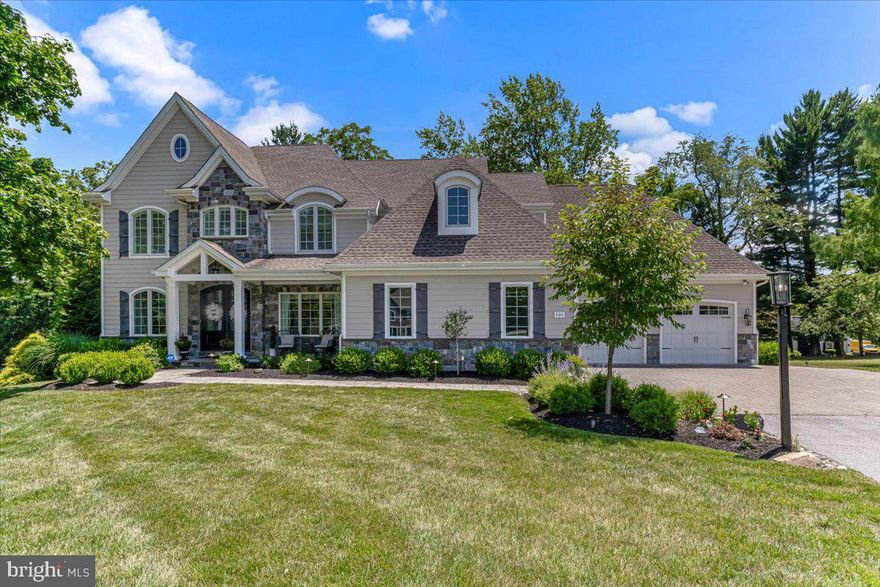 2020 HBA Award Winner “Lafayette” by Megill Homes is available for sale. Sited on 2+ acres in Chester County’s Thornbury Township, Rokeby Farm Lane is home to 4 unique custom luxury homes on large lots, and is concealed from South Concord Road by historic stone walls, punctuated with elegant gates. 101 Rokeby Farm welcomes you with a covered flagstone front porch and arched mahogany french doors. Inside, a parlor with lineal wall fireplace, a wall of custom built-in cabinetry, window seats. 9’ barn doors reveal wet bar. Family Room features box beam coffered ceiling, quarried stone fireplace, loads of natural light. Offset from kitchen by informal dining area, sliders to Timbertech deck. Kitchen will delight the luxury buyer with 48” Wolf Range w/dual ovens, powerful exhaust, abundant LED lighting. A rare white granite gorgeously complements the white Century cabinets. Undermount microwave, farmhouse Kohler sink, SubZero fridge. Formal dining room w/shadowbox trim and custom paint. Note how lighting fixtures are installed w/trim detailing. Mudroom access to the 2 deep and high garages (for a total of 3 bays) where you will find a bench with cubbies, huge coat closet, secondary access to deck. Main living level is completed with a substantial home office or guest suite with walk-in shower, private balcony, and walk-in closet with custom organizers. The upper level owner’s suite is a welcome change from the typical. The master bedroom is a cocoon of tranquility, large enough to comfortably accommodate a king size bed and furniture. The owner’s suite lounge (boudoir?) is a private den with wet bar, wine fridge and barn doors that reveal two substantial dressing rooms with custom closets. From the lounge, access the master bathroom with freestanding tub, walk-in shower with designer tile and frameless doors, and totally separate furniture grade vanities with granite tops. Three additional guest rooms complete the upper level: one with en-suite bath and walk-in closet, and two that share a jack-n-jill bath. The walkout lower level offers thoughtful use of finished and unfinished space. There is also a highly detailed wet bar, fridge, and full bathroom with walk-in shower. *Note the dimensions of the oversized garages! These are not typical sized garage bays.* Located near route 202 and 1 commuter routes, 30 minutes to to PHL. Nearby shopping includes Whole Foods, Target, Costco, Wegman’s, Anthropologie, and more. QBW Builder’s Warranty Transfers to New Owner. Showings by Listing Agent. Financially Qualified buyers only.