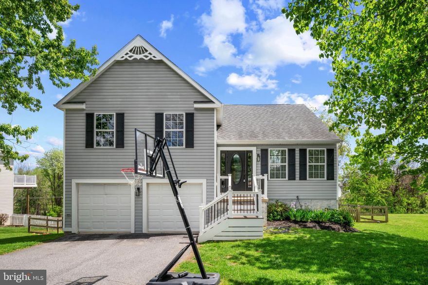 Welcome to this beautifully updated home in the quiet, charming town of New Windsor, where comfort, style, and outdoor living come together seamlessly.

Step inside to an inviting open-concept main level featuring a spacious living room, dining area, and a stunning updated kitchen with granite countertops, stainless steel appliances, and a modern farmhouse feel. Fresh paint throughout gives the home a bright, move-in-ready appeal. From the main living area, walk right out onto the expansive upper deck—perfect for entertaining or simply enjoying the peaceful surroundings.

This home offers four generously sized bedrooms and three full bathrooms, including a serene primary suite with vaulted ceilings that create an airy, retreat-like atmosphere.

The lower level is equally impressive, featuring a walkout to a second deck and a beautifully designed patio area. With a large family room, playroom/game room, additional bedroom, and full bathroom, this space is ideal for guests, recreation, or multi-generational living.

Outdoor living is truly exceptional here, with two newly built decks crafted from high-end materials, a new patio, a pool with its own deck, and a fully fenced backyard—perfect for relaxing, entertaining, or enjoying warm summer days.

Additional highlights include ample driveway parking and a spacious two-car garage.

This home offers the perfect blend of modern updates, functional space, and standout outdoor features—all in a peaceful small-town setting.