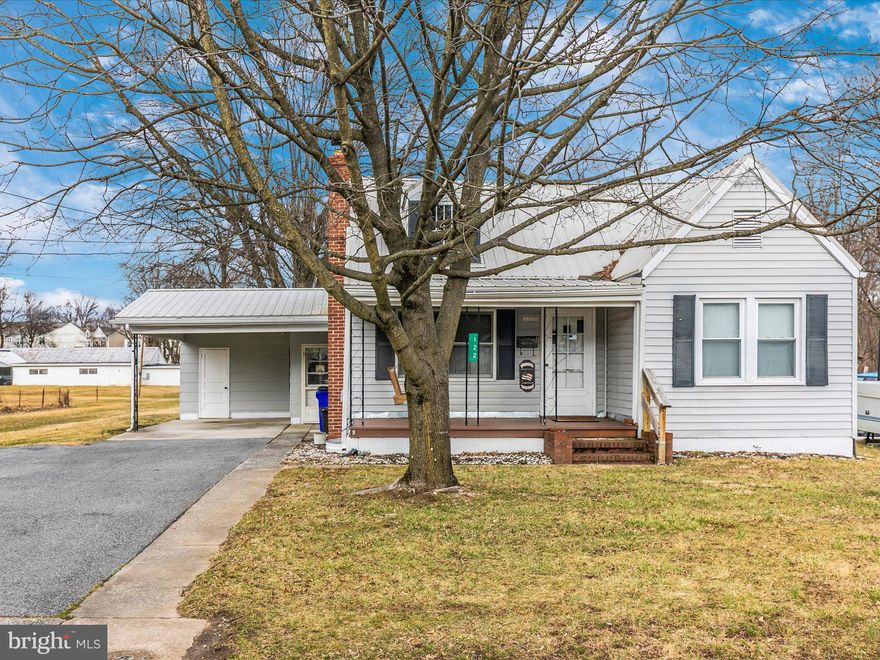 Nestled in the scenic town of Thurmont, MD, this cozy Cape Cod-style rancher offers a perfect blend of charm, comfort, and potential. Set in a peaceful yet convenient location, this home is just minutes from local schools, shopping, parks, and major routes like Rt. 15—making daily life a breeze while keeping the beauty of Catoctin Mountain Park and Cunningham Falls State Park close at hand.  Step inside to a warm and inviting living room, perfect for relaxing or entertaining. A separate dining room provides an intimate space for meals, while the kitchen opens to a spacious enclosed rear porch/sunroom, ideal for enjoying your morning coffee or unwinding at the end of the day. The main level offers two comfortable bedrooms and a full bath, while the partially finished attic presents endless possibilities—whether you need a third bedroom, a craft space, or a private home office. The expansive rear enclosed porch is a standout feature, complete with a laundry area and a patio door leading to the greenhouse, perfect for plant lovers or year-round gardening. A wide staircase from the porch provides easy access to the basement, offering storage and  workshop space. Outside, you'll find a one-car carport and two sheds (including one conveniently attached to the carport). Thoughtful updates have been made, including a durable metal roof (installed approximately 10 years ago), a new water heater (2018), and various improvements completed two years ago, such as foundation painting, downspout repairs, and a dining room floor update. Located in the Gateway to the Mountains, Thurmont offers small-town charm with big outdoor adventures.