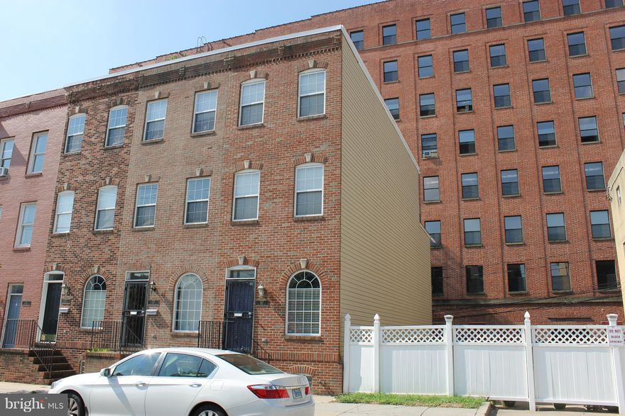 Gorgeous 3 BR 3.5 BA brick front executive town home with parking.  2 car driveway.   Home built in 2005.    
Refinished hardwood floors, high ceilings, fresh paint, crown molding, chair rail,  new stainless steel appliances, granite countertops, and breakfast bar.  1/2 bath on main level.   The primary floor features wet bar and marble bath.   Basement features finished area  with tall ceilings and separate laundry room/storage area.  New carpet in the basement.  4 levels of living space! Close to downtown attractions. Attention potential homeowner:  Possible grant money may be available on this one.  Contact me to see if you qualify for the grant program.