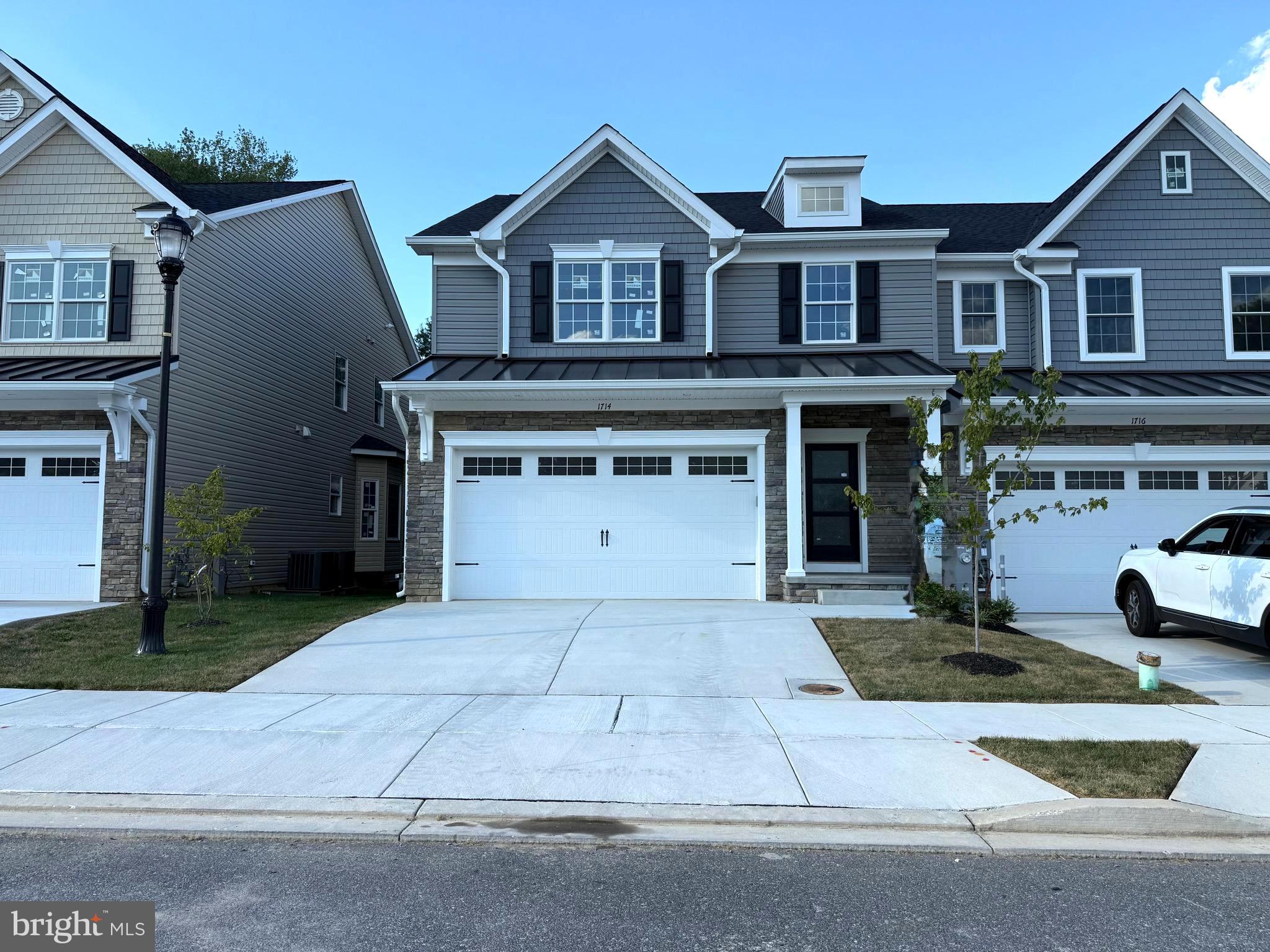 Open House This Saturday from 12-3 pm. Quick delivery End Unit just needs hardwood steps poly-urethane and it’s ready to go! Call Carol to see unit. Stop by 1714 Botanical Ct and agent will give you a tour. Eldersburg's new Doroly Gardens 55 & older upscale community will have 28 units when completed. This custom home is built with quality materials inside & out, 2x6 exterior walls, recessed fire sprinklers in finished areas! Exterior features include cultured stone, vinyl siding & cedar look vinyl shake accents. Solid hardwood floors 5" wide is included in foyer, kitchen, great room, all BR's and loft area. Quality Andersen double hung tilt windows with full screens & sliding door included. The 1st floor includes a foyer with coat closet, half bath with taller vanity, granite counters, ceramic tiled floor and conveniently located first floor laundry room with ceramic floor. The spacious kitchen is open to great room and includes: island with breakfast bar, pendant lighting, soft close cabinetry w/roll out trays, trash/re-cycling drawer, granite counters, ceramic tile backsplash, under cabinet LED lights. Whirlpool stainless steel appliances include: gas range , plus a under counter wall oven (so 2 ovens!) dishwasher, microwave plus a garbage disposal. Great room with vaulted ceiling, ceiling fan, natural gas fireplace with mantle & marble surround with sliding door to covered rear porch with electric outlet & recessed lighting. First floor owners suite with hardwood floor, tray ceiling & ceiling fan, ensuite full bath with large ceramic tile floor & shower surround, taller vanities, double sinks, granite counters large shower, linen closet & walk-in closet. Take the stairs to second floor with oak stair treads with white risers & oak railings with black wrought iron balusters. Second floor includes a huge loft with hardwood floors & ceiling fan, linen closet, 2 spacious BR's with walk-in closets, ceiling fan & hardwood floors. Second floor also includes a large full bath with double vanities, granite counters, plus bathtub & commode in a separated room all with over-sized ceramic tile. Located off the loft is a large mechanical/storage room. The full basement is unfinished and includes a full bath rough-in, rough-in for wet bar, plus an egress window & single door basement exit to yard. Basement could be finished at an additional cost to Buyer. The home also includes a two car garage that is insulated, drywalled, painted with garage door opener & exterior keypad. The Trane HVAC is a two zoned heat pump with natural gas back up heat & CAC. Monthly condo fee $225 includes lawn care, trash service, road maintenance, street lights, snow removal & exterior mulching. There are 2 end units 1714 & 1712 Botanical Ct and one interior unit available for sale at 1710 Botanical Ct. BUILDER OFFERING $5,000 TOWARDS BUYERS CLOSING COSTS WITH USE OF BUILDER RECOMMENDED LENDER ONLY, WITH FULL PRICE CONTRACT!