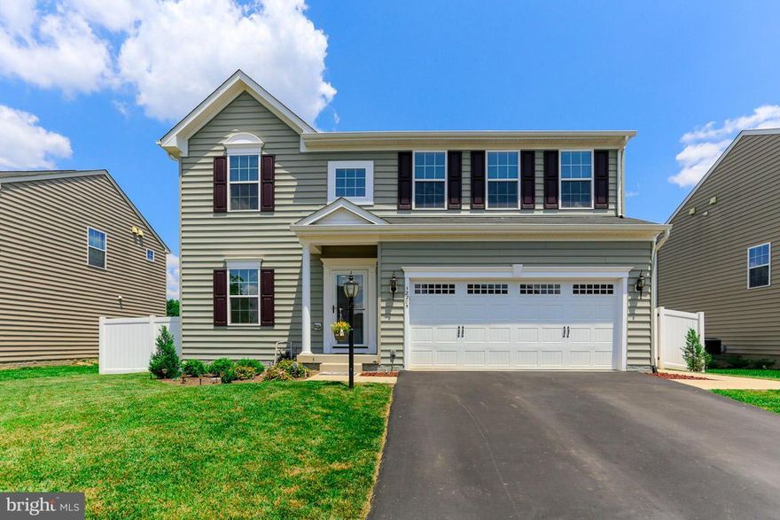 Just 2 years old, this like-new home in the sold out community of Three Flags is move in ready! Large family room with berber carpet and gas fireplace with remote and blower. Generously-sized bedrooms (see dimensions)! Owners have added a 16x24 deck, 6' vinyl privacy fence, concrete patio and walks, hot tub, humidifier, garage door opener, 3 ceiling fans, and washer/dryer.