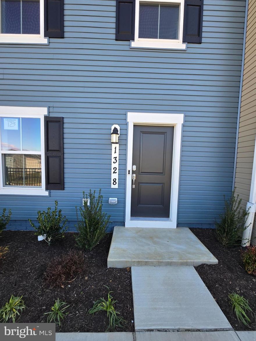 Move-in Ready! This stunning, brand-new townhome in the Lennar at Red Clover community, nestled in the heart of Ranson, WV, offers modern living at its finest. Featuring three levels, this home boasts a Back-load Two-car garage and a spacious entry-level fourth bedroom with a full bath.
The second level presents an open-concept floor plan, seamlessly connecting the Great Room, dining area, and a stylish kitchen adorned with sleek granite countertops and stainless steel appliances. Enhanced Vinyl Plank flooring throughout the main level adds both durability and elegance. 
The top floor includes three well-appointed bedrooms, highlighted by the luxurious owner's suite complete with a spa-inspired bathroom and a generous walk-in closet. A conveniently located full bath serves the secondary bedrooms, ensuring comfort for all.