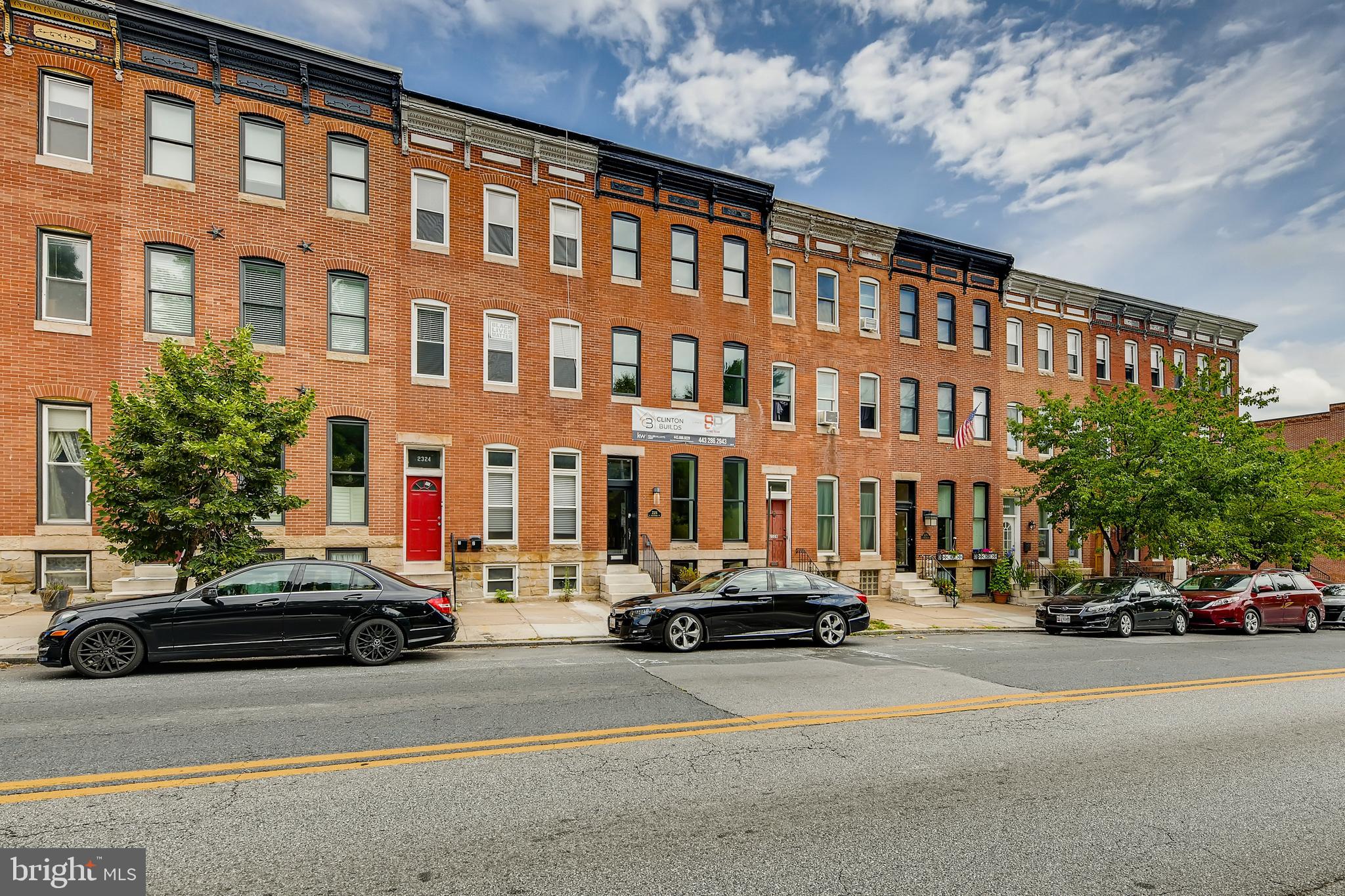 Breathtakingly renovated row home by Clinton Builds facing Patterson Park in the desirable neighborhood of Butchers Hill. You will be astonished by the wondrous architectural designs once you step inside this four story, 4BR/5BA brick and beautiful stone to grade row home. No expense was spared on the attention to detail throughout each and every floor, beginning with marble entry steps leading to a full glass front entry door, custom handcrafted wood and iron railing, soaring tray ceilings, exposed brick, wainscoting, crown moldings, hardwood flooring, lighting fixtures and the original fireplace mantel. The main floor features a large living room with floor to ceiling windows that let in an abundance of natural light. You will find a large open concept dining room with a faux fireplace and a kitchen that features high end appliances including; a wall oven with built-in microwave, extraordinary quartz counters, ceiling to floor subway tile, herringbone pattern backsplash above a gas cooktop with a convenient pot filler, and a stunning waterfall sink island with seating for four. Walking up to the second floor you have a full view of the main floor including the open stairs leading to the lower level. Once on the second floor you find a large master bedroom suite with a private bath that features double sinks and a claw foot soaker tub with an overhead shower flanked by ceiling to floor subway tile. At the opposite end of this floor you have your second spacious bedroom with a private bath that features a walk in shower. The laundry is behind double doors and has plenty of room for storage. Up one more floor to find the third and fourth bedrooms each with their own private baths and a wet bar. From the third floor you have access to the phenomenal rooftop trex deck with views of the city and Patterson Park. We're not done yet, on to the lower level which has plenty of natural light beaming in from the main floor windows and the open stairs, you have perfect space for a den, office or playroom, storage and a fifth full bath with a walk-in shower. You won't want to miss the opportunity to step inside this meticulously renovated home and call it yours forever. All this and more including a large trex deck on the rear w/ carport underneath, new HVAC, windows, plumbing and conveniently located near Canton Square, Johns Hopkins and I-95. Visit a virtual tour here: https://tinyurl.com/y7h5l9x5