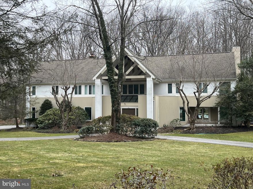 Come see this bright & open 4 Bedroom 3 1/2 Bath Custom Contemporary Home on fabulous 2 acre lot with inground pool, pond and so many special features! The high ceilings and abundance of natural light brings to life this fabulous open floorplan and generous spaces within.  Plentiful rear glass windows & doors allow for views of the outdoor living space and pool/spa area and helps to bring the outside in. Enter the grand foyer with marble floor,  vaulted ceiling & skylights with a large walk-in coat closet and Powder Room. The spacious Dining Room enjoys French  doors to the patio and shares a glass block half wall with the Kitchen  The Granite Kitchen  with hardwood floors & island includes a breakfast nook with matching granite table overlooking the pool area.  And the Family Room with hardwood floors, wet bar and fireplace also has French doors to the deck and rear entertainment area and is open to the round Sun Room with beamed cathedral ceiling, skylights and double French doors. The formal Living Room with 2nd fireplace and 2-story marble surround,  hardwood floors & French doors to the deck complete the main level.  The Upper Level includes the Primary Bedroom with separate Sitting Room and access to the upper deck as well as a large Primary Bath with granite counters, soaking tub & shower. 2 of the additional bedrooms each have private baths and share a loft area and there is also a 4th bedroom on this level as well as a Laundry Room &  large cedar closet.  The spacious Recreation Room on the lower level is perfect for family gatherings and there is a Storage Room with exit door and work bench.  The awesome rear yard includes  an inground pool with spa area and lots of space for outdoor enjoyment.  This fabulous home has 10 ft. ceilings on the main level, 9' + ceilings upstairs,  Bristol Windows and a 3 zone HVAC.   Wonderful home lovingly cared for by original Owner.