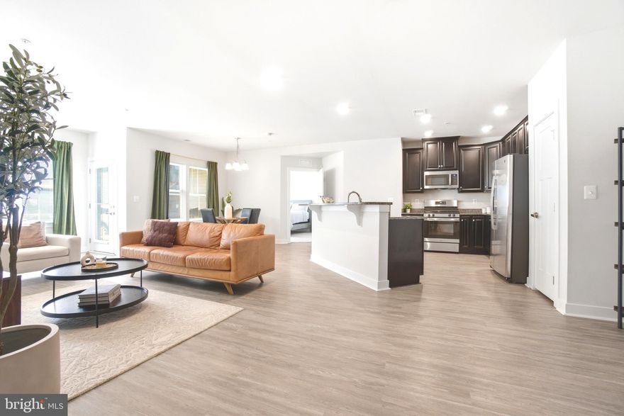 Luxury Condo Living at Paddock Pointe,  Laurel, MD *** Welcome to Paddock Pointe, a sought-after transit-oriented community just steps from the MARC Train; perfect for commuters and those seeking convenience and lifestyle in one place. This beautifully designed condo offers a spacious, flexible floor plan with modern finishes and abundant natural light throughout. ✨ Home Features: Bright, lovely open-concept Great Rooms with large windows | Private balcony or patio for outdoor relaxation | Stylish kitchen with brand new cabinetry & large pantry | Spacious primary suite with walk-in closet & dual vanity bath | Second bedroom with large closet + optional flex space (ideal for office or playroom) | Second full bath & in-unit laundry | Optional fireplace for added comfort 🌿 Community Amenities: Dog park  |  Community garden   |    Kayak launch   |  On-site dining & entertainment   | One-level living with the space you need and the lifestyle you deserve.📍 Prime Location:  Located in Laurel, Howard County, with easy access to Rt. 1, I-95, Rt. 32, and the Baltimore-Washington Parkway—making commuting to DC or Baltimore simple and convenient. 
🛠 Low-Maintenance Lifestyle: Exterior maintenance, landscaping, and snow removal are all included, giving you more time to enjoy life, travel, or relax.