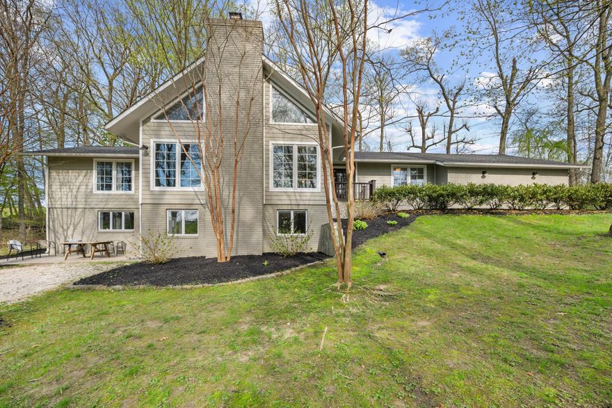 Nestled in the serene Glyndon community, this stunning contemporary residence with complete lower level In-Law Apartment with its own adjoining parking offers an amazing opportunity to welcome occasional or permanent guests! With a major renovation completed in 2015, the home boasts a modern aesthetic while retaining its inviting charm! Spanning over 3.55 acres, the property is enveloped by lush trees, providing a secluded retreat from the hustle and bustle of daily life! Step inside to discover an open floor plan that seamlessly connects the gourmet kitchen with a 14 foot peninsula countertop, soft close cabinets, dovetail custom joinery! an undermount kitchen sink, beautiful drum shades over the Peninsula, stainless steel KitchenAid and Whirlpool appliances, Stainless exhaust hood over stove, propane fuel stove! A New water filtration system has recently been installed! Gracious family room and great room, perfect for entertaining! The elegant crown moldings and rich hardwood floors enhance the warmth of the living spaces! The home features five spacious bedrooms and two cozy fireplaces, creating an inviting atmosphere for gatherings! Enjoy the convenience of ENERGY STAR Stainless appliances, including a self-cleaning oven! A floor to ceiling pantry! Outside, the expansive deck invites you to unwind and soak in the tranquil surroundings! The side-entry garage and paved driveway provide ample parking, while flood lights and a satellite dish add modern conveniences! This property is not just a home; it's a lifestyle, offering a perfect blend of luxury, comfort, and nature! Other Amenities include Crown molding, simulated true divided light windows throughout, recessed lighting throughout, hardwood floors throughout, hot-water baseboard heating, French sliding doors, three-quarter tall windows, freshly painted, bead board at Peninsula, Jack and Jill bath on main floor, six panel door bedroom and closet doors throughout, large closets in each bedroom, cathedral ceiling in the Great Room!