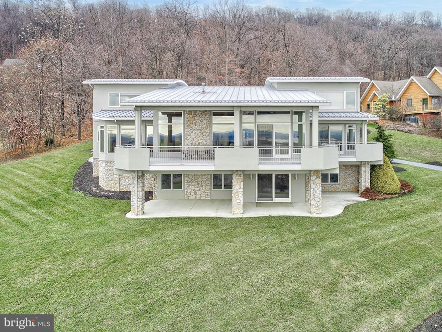 An entertainer's dream! This impeccable contemporary home offers stunning panoramic views of Harrisburg. The open floor plan, floor-to-ceiling windows and covered terrace create an ideal ambiance for entertaining. The home offers five bedrooms, which include two primary suites (one located on the main floor), three baths, one powder room, walk-in closets, granite countertops, deluxe kitchen appliances, a three-car garage, mudroom and laundry room, and an enormous unfinished walkout basement waiting for you to make it your own!