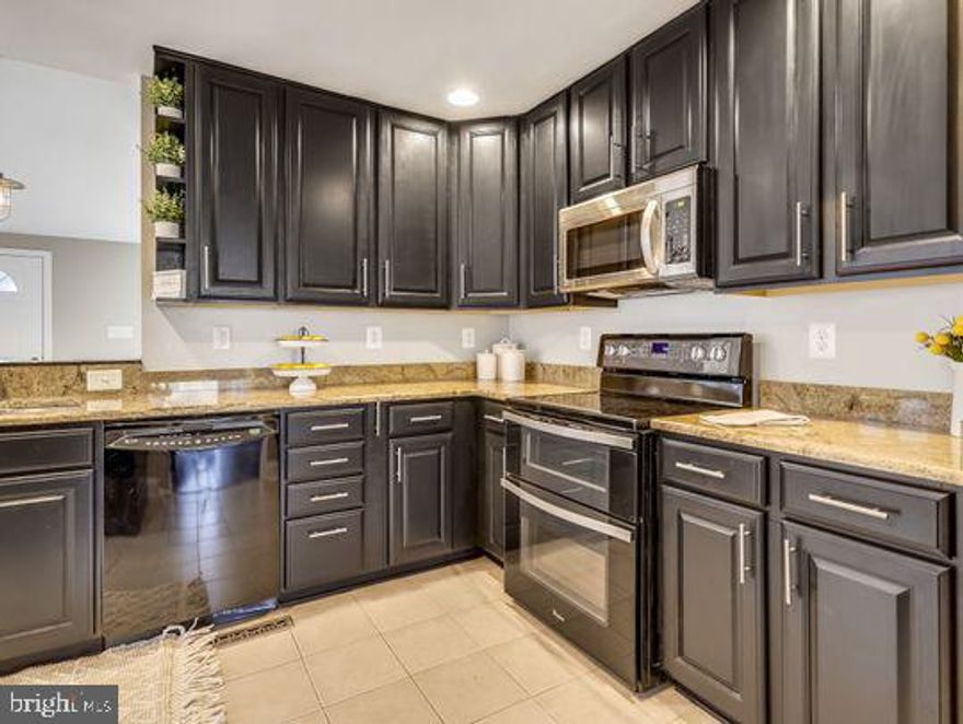 Updated and move in ready!  This is a must see, 2 Bedroom, 2 Full Bath with an additional large lower level office. Primary bedroom on main level with large sitting area that would be perfect for a nursery or could be a large walk in closet. Living room is bright and beautiful wood grain floors. New carpet, paint. Large eat in kitchen with tons of cabinets, double oven , granite counters  and a bar area.  The lower level features 2nd bedroom, full bath and family room/office. Great back yard with newer deck and completely fenced.

Professional Pictures coming soon!