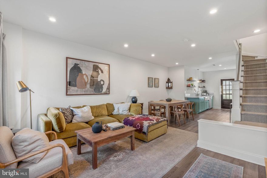 Step into something truly special at 334 Greenwich St, a dreamy blend of timeless charm and modern amenities, nestled on a quiet, low-traﬃc block in the heart of Pennsport. This hidden gem oﬀers 2 bedrooms, 1 bathroom, a secluded patio, central A/C, and thoughtfully crafted details that create a homey, eﬀortlessly cool vibe. Located just oﬀ lively Moyamensing Ave and sprawling Dickinson Square Park, a classic red brick facade with black trim and an extra-tall dusty blue door sets the tone out front. Inside, the open, airy, light-filled main level impresses with soaring ceilings, warm neutral flooring, and an inviting layout with plenty of space for both living and dining. The Pinterest-worthy, sunlit kitchen is a true centerpiece, boasting vibrant
shaker cabinetry, natural stone counters, stainless steel appliances, and floating shelves. Special touches include a curved counter overhang with a single seat for prep, vintage-style brass-tone fixtures, a massive farmhouse sink, and a delicate pendant light. A single French door with hefty hardware opens to a hidden patio oasis, fully enclosed for privacy and perfect for entertaining, grilling, or quiet mornings alone.
Upstairs, the large primary bedroom features two tall windows and generous closet space, while a bright second bedroom sits just down the hall. The home’s final highlight is the serene full bathroom that acts as a daily retreat, complete with an ornate double vanity, striking sconces, hexagon tile floors, and a massive glass-enclosed dual-head shower. An expansive, clean, dry basement has the laundry and extra storage. In
addition to everything inside, 334 Greenwich St earns a Walk Score of 89. The surrounding blocks are filled with beloved local spots like Grindcore, Jaxx Steaks Taproom, and Aroma on 3rd. Nearby shopping includes Target, Giant, Ikea, and Lowe’s, plus easy access to public transit, Washington Ave, Delaware Ave, I-95, and
South Jersey. Schedule your tour today!