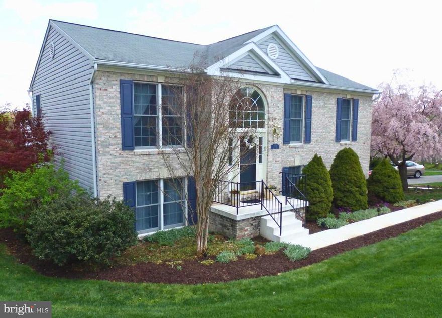 Motivated seller has priced this property $100,000 below market value! Don't miss out-this won't last!

Nestled on a scenic 1.05-acre lot, 9956 Kelly Road offers the perfect balance of tranquil country living and modern convenience. This brick-front home features an open-concept main level highlighted by vaulted ceilings, a spacious kitchen, and a rear deck that provides views of the beautiful Maryland landscape. The primary suite serves as a private retreat with its own vaulted ceilings and ensuite bath, complemented by two additional bright bedrooms on the main floor.

The living space doubles in the fully finished, walk-out lower level, which boasts 9-foot ceilings, a family room, and a secondary gathering area that opens directly to a patio. With a fourth bedroom and a third full bathroom, this level is ideally suited for guests, a home office, or just extending your space. Just minutes from major commuter routes, this property offers a rare opportunity for peaceful, spacious living while remaining close to the heart of the community.