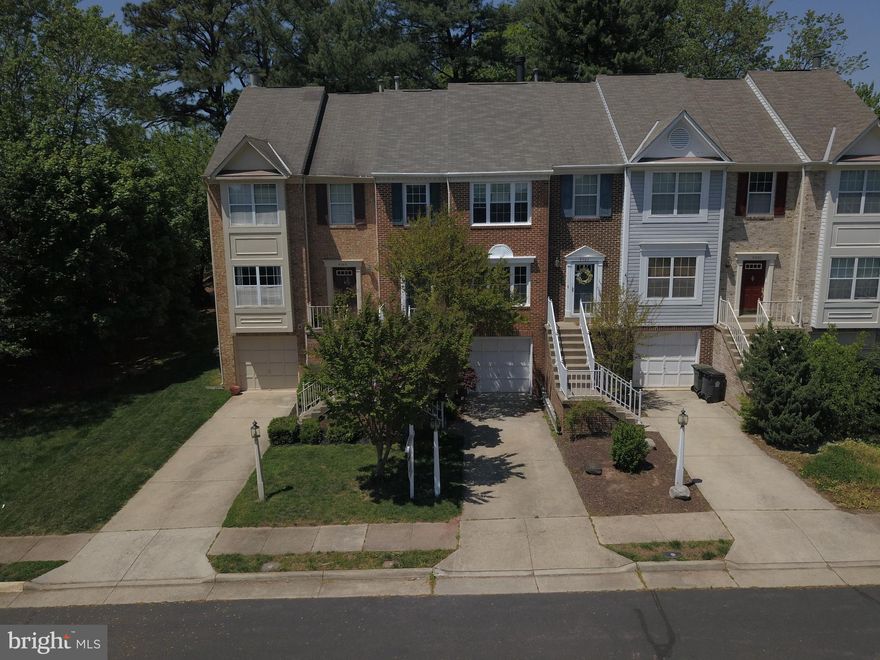 Immaculate move in ready 3BR, 2FB, 2HB, Brick Front, Garage Townhome in sought after Old Town Station. Ceramic tile basement and hardwood throughout the upper two floors. New Kitchen with granite tops. 2 assigned off street parking spaces PLUS driveway and garage. Private oasis back yard. Mature plantings. Less than a mile from center Old Town Manassas, VRE train, and many shops and restaurants.