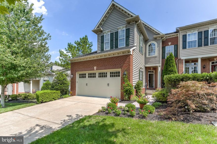 STUNNING & SUNNY TOWN HOME IN THE SOUGHT AFTER GATED COMMUNITY OF WOODHOLME IN THE HEART OF PIKESVILLE. THIS 4 BEDROOM/3.5 BATHROOM HOME BOASTS 3000+ SQUARE FEET OF COMFORT W/ SOARING 40 FOOT CEILINGS ON THE MAIN FLOOR W/ GLEAMING HARDWOOD FLOORS. GOURMET EAT-IN KITCHEN W/ GRANITE COUNTER TOPS, ISLAND & HIGH END APPLIANCES. MASTER SUITE ON MAIN LEVEL W/ TRAY CEILING & IMPRESSIVE WALK IN CLOSET. SOAKING TUB + WALK IN SHOWER IN MASTER BATH. TWO BEDROOMS ON UPPER LEVEL + LOFT STYLE FAMILY ROOM OVER LOOKING LIVING ROOM. FULLY FINISHED LOWER LEVEL W/ SPACIOUS GAME ROOM & 4TH BEDROOM.  PRIVATE DECK PERFECT FOR ENTERTAINING W/ PARTIALLY WOODED VIEWS + CUSTOM IRRIGATION SYSTEM INSTALLED AROUND ENTIRE PROPERTY. COMMUNITY HAS MANY AMENITIES & SECURITY FEATURES. HURRY!