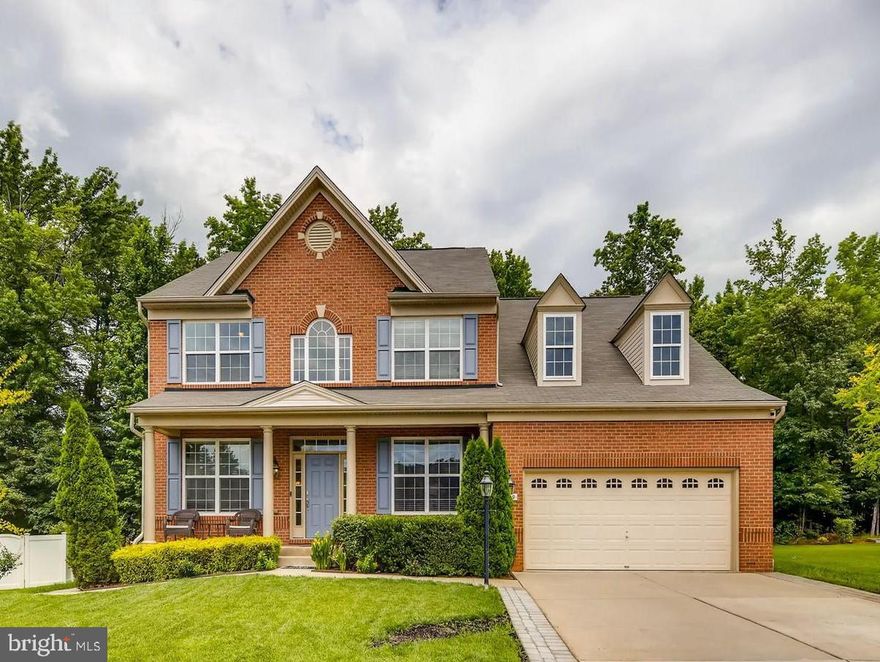 Experience luxury, space, and functionality in this stunning brick-front colonial located in the highly sought-after Tanyard Springs community. This is the largest model built in the neighborhood, offering over 4,700 sq. ft. of beautifully finished living space… The upper-level features four generously sized bedrooms, including an impressive primary suite with TWO walk-in closets and a spa-like bath with a soaking tub and separate shower. Both upper levels boast rich hardwood flooring throughout… The heart of the home is the gorgeous, upgraded kitchen, complete with premium appliances — including a touch-screen smart refrigerator — a large breakfast bar, and an open flow into the sunroom dining area. The entertainer in you will love the expansive Trex deck, perfect for summer gatherings, which leads down to a stunning stone patio with a built-in fire pit… The main level offers exceptional living space, featuring a formal dining room, spacious living room, family room, and a versatile den/office… The basement is a showstopper. Not only does it include a dedicated recreation/entertainment room, but it also offers a full 2-bedroom apartment with its own private rear entrance, complete kitchen, and separate laundry,  ideal for multigenerational living, guests, or rental income potential... This home truly has it all, space, upgrades, and an unbeatable layout... A must-see in Tanyard Springs!