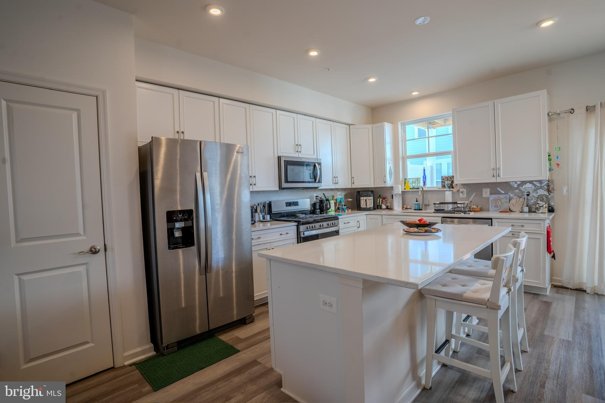 Welcome to Deep Harbour Townhomes in beautiful Cambridge, Maryland! Located in a secure, gated community, this Energy Star® and Indoor Air Plus Certified end-unit townhome—built in 2022—perfectly blends coastal charm with modern comfort.
Offering three spacious bedrooms and two and a half bathrooms, the thoughtfully designed floor plan combines style, functionality, and an abundance of natural light. Enjoy multiple outdoor living spaces, including a walk-out first-floor terrace and two upper decks—ideal for relaxing or entertaining—while taking in serene water and community views.
The current owners have added a host of upgrades, including custom kitchen cabinetry with a designer backsplash, LED lighting, a tankless water heater, beautifully updated bathrooms and powder room, and upgraded flooring throughout.
Deep Harbour residents enjoy resort-style amenities such as a community pool, clubhouse, and scenic walking trails. From the kitchen/dining area and the primary bedroom, you can soak in beautiful water views—a daily reminder of the charm and tranquility of the Eastern Shore.
With its meticulously crafted interiors, prime location, and vibrant community, this home offers the perfect balance of elegance, convenience, and comfort. Don’t miss the chance to make it yours!