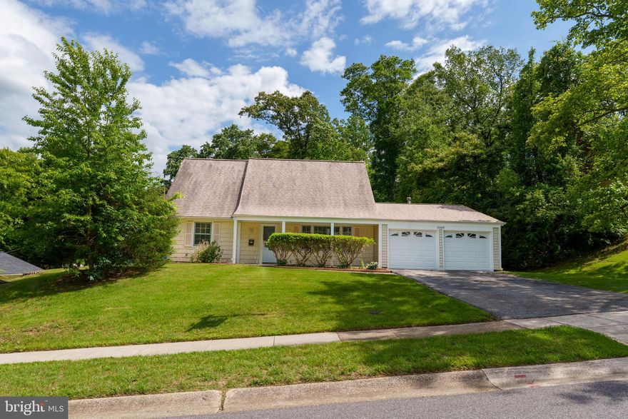 Charming Cape Cod featuring two main-level bedrooms, brand-new luxury vinyl plank flooring in the living room, fresh carpet upstairs, and new paint throughout. Relax on the inviting front porch or enjoy the privacy of the fenced backyard with a patio—ideal for outdoor gatherings. This rare two-car garage home provides ample parking and storage. Conveniently located within walking distance to the bus line, schools, and shopping. Notable updates include a roof (2018), hot water heater (2016), HVAC (2012, recently serviced), and several replaced windows along with the rear sliding door. Home is being sold as-is.