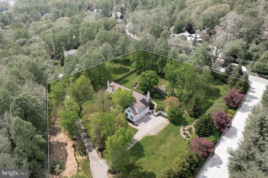 Welcome to this stately stone front colonial on over 2 acres in award winning Tredyffrin-Easttown School District. Tucked away amongst mature landscape and situated next to the rolling hills of a horse farm, this property offers both convenience to major routes and amenities, as well as privacy and a serene setting. Enter from the expansive foyer to be greeted by beautiful hardwood flooring, extensive moldings and an open staircase. The formal sitting room to your left offers a gas burning fireplace, attractive molding and access to your first floor study. The first of two powder rooms can be accessed here as well as glass doors to the backyard and patio area. The formal dining room features a tray ceiling and custom built in butlers pantry and wet bar with attractive back lighting. The kitchen bright and airy with an island, built-in refrigerators, separate cooktop, double oven and granite countertops, as well as an eat in kitchen area with sliding glass doors to the patio. Enjoy indoor/outdoor living and entertaining with such a well thought out layout. The family room is open to the kitchen with a huge wall of windows to let the outside, in. The family room also features an attractive floor to ceiling stone fireplace. For your convenience an oversized laundry room with ample custom storage is located on the main level. The coveted “mud room/drop zone” can be accessed both from the garage and the back yard, and is also adjacent to the second powder room, making cleaning up when coming home from sports or outside, a breeze. The second story of the home can be accessed via the back staircase, or the formal entry staircase. The master bedroom suite is impressive, from it’s custom built-ins, to the sitting room with floor to ceiling window, to the spa-like master bath with soaking tub and glass stall shower. This space will be your true sanctuary. You will also noticed how the uplighting in the master bedroom sets off the crown molding. The master closet is outfitted with custom organizers and adjustable shelving. Four additional bedrooms occupy the second level. One is quite large and has it’s own full ensuite bath. The second full bathroom is accessed from the hall with dual sinks, and the third is a jack and jill style bath between two of the other spacious bedrooms. The entire first and second floors offer site finished hardwood flooring, with the bedrooms being cork flooring (great for noise and warmth!) and the baths offering tiled flooring. Downstairs, the lower level is expansive and gives more room for work, fun, or entertainment! With a wall of windows letting the daylight in, this space feels as much a part of the home as the first and second stories. This level can be accessed directly from the garage, and also includes a kitchenette and full bath. The open space in the lower level is great for multiple uses. Currently this area is being used as a den, library, studio and crafting space. Possibilities abound! Outside, the grounds are set up for hosting and enjoying. The back yard is terraced and includes a beautiful patio, water feature and steps up to a covered pergola. The mature trees around the property give the back yard a sense of seclusion and unmatched natural beauty. Make your appointment today to tour this stately home located close to downtown Malvern, Valley Forge Park, King of Prussia and many more major routes and amenities. Truly a beautiful place to call home!