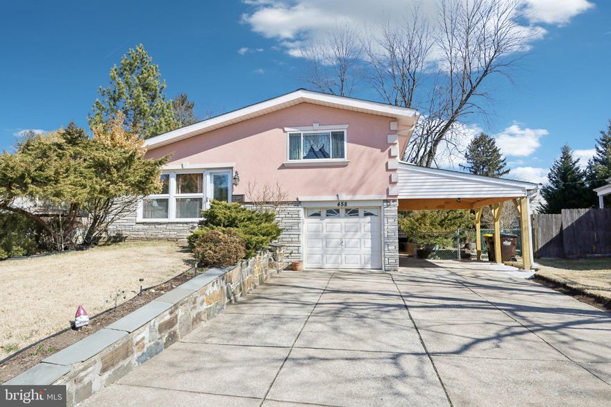 Welcome to this beautifully updated and bright split-level home, ideally located in the heart of King of Prussia. As you enter, you’re greeted by a bright and airy main level with soaring vaulted ceilings boasting skylights providing an abundance of natural light. The spacious living room flows seamlessly into the formal dining room, both featuring gleaming hardwood floors. This open-concept space leads into the stunning, fully renovated kitchen, which boasts a large center island, sleek granite countertops, and an abundance of cabinet and counter space. A cozy breakfast nook and impressive vaulted ceilings with expansive windows enhance the kitchen’s charm. A door off the kitchen opens to the two-tiered back deck, perfect for relaxing or entertaining. On the second level, you'll find three well-sized bedrooms, all featuring hardwood floors, including the spacious primary bedroom. A full hall bathroom with modern finishes completes this level. The lower level offers a cozy family room with a gas fireplace, ideal for relaxing or hosting friends and family. Sliders off the family room lead directly to the back patio, making outdoor living a breeze. This level also includes a full bathroom with a soaking tub, adding extra convenience and comfort. A door leads out to the carport, while the laundry room provides access to the attached one-car garage. The unfinished basement offers excellent storage space or the potential to be finished for even more living area. The expansive, fully fenced backyard is a true retreat, featuring the two-tiered deck, a patio, and a personal above-ground pool — perfect for summer fun and outdoor gatherings. Recent updates include a new roof and skylights (2018), a new carport (2024), a new hot water heater (2024), updated stucco exterior with added insulation, high-efficiency HVAC, and an electric vehicle charger and power generator hookup with transfer switch. This home’s prime location places it just minutes away from the world-renowned King of Prussia Mall, a variety of dining options, scenic biking and running trails, Valley Forge State Park, and easy access to all major highways. With a perfect blend of modern amenities and classic charm, this home is ready to be yours!