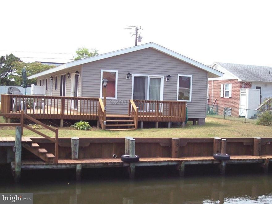 ''REDUCED'' BEAUTIFUL RENOVATED SINGLE FAMILY CLOSE TO THE BEACH AND ON A CANAL. DOCK FOR BOAT TIE-UP, 4 BR 2 BATH, NEW KITCHEN, CERAMIC, WOOD FLOORS. FLORIDA ROOM ADDED. NEW WINDOWS, NICE DECK. COULD NOT BE NICER.