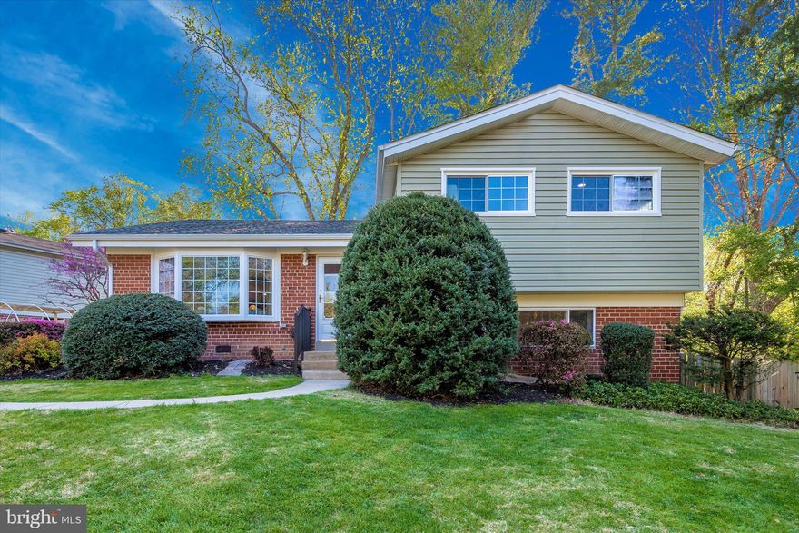 Welcome home to an IMPRESSIVE, bright and spacious four bedroom, two and one-half bath split level home with a LARGE MAIN LEVEL EXTENSION!  You will be amazed by the soaring ceilings and skylights in the large open kitchen with an eat-in kitchen area,  bright and LARGE OWNERS SUITE ON MAIN LEVEL with two closets and a grand master bathroom with a soaking tub, shower and large vanity.  This home has recessed lights in every room!  Just up a few stairs you will find three bedrooms and a full bath with a bathtub.  The entire lower level can be used as a workout room, rec room, playroom, or large home office.  Moreover, this home has handicapped access!  Have groceries to bring in your home? Just roll your wagon or cart through the ramp right into your wide double sliding glass door.  Super convenient.  Kitchen has an instant hot water faucet and a wood pellet stove that will heat up nicely in the winter and is a green source of energy.  The backyard is large and private with mature trees and great shade and is ideal for both relaxing and entertaining.  This home also features a backup generator.   Ready to garden?   This beautiful home has a raised garden bed fully ready to grow veggies and/or fruit.  And an attached strawberry planter!  Plenty of storage in the crawl space and roof was replaced 1.5 years ago.  Potential to create a third full bath in utility room.  Prime location.  Conveniently located just minutes to the metro, Rock Creek Park trails, downtown Rockville, major commuter routes, and so much more!