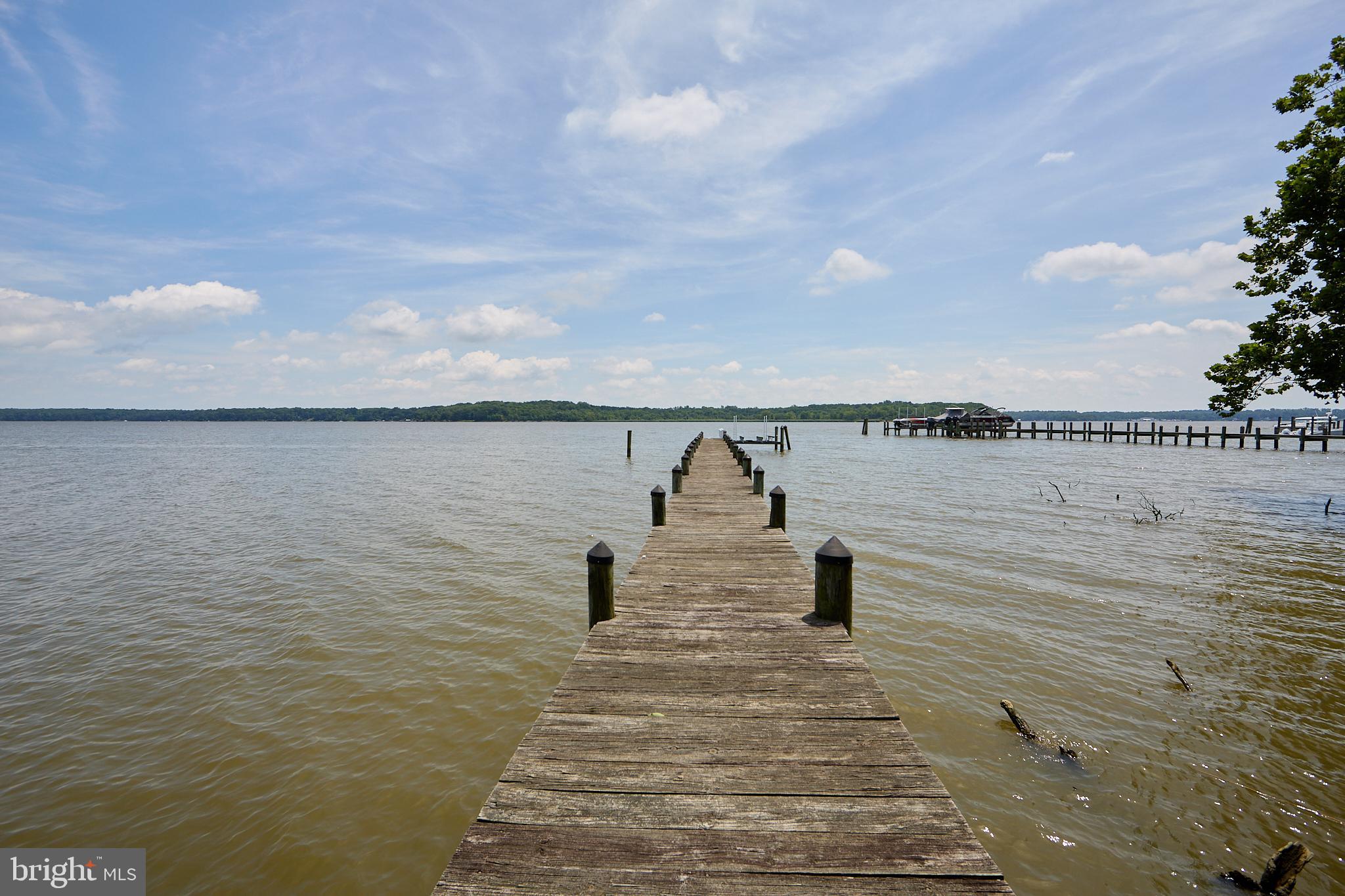 MOTIVATED SELLER ALERT!!!! Location, Location, Location!
Welcome to your waterfront paradise—2.5 stunning acres on the Elk River with unmatched views and endless potential! Start your mornings with breathtaking sunrises from the deck, relax on your private beach at low tide, or head out on the water from your private dock—perfect for boating, jet skis, and exploring the Chesapeake Bay. This 5-bedroom, 2-bath home offers a spacious open floor plan centered around a massive great room with floor-to-ceiling brick fireplace and panoramic river views. The primary suite features an en-suite bath and walk-in closet, while four additional bedrooms provide plenty of space for family or guests. The lower level is unfinished, ready for your custom design. Two bookend garages frame the home, leading into a central walkout entertainment area—a rare and versatile layout. This home needs your personal touch, but once complete, it will be a true masterpiece on the water.
Don't miss this once-in-a-lifetime opportunity to create your dream waterfront retreat!