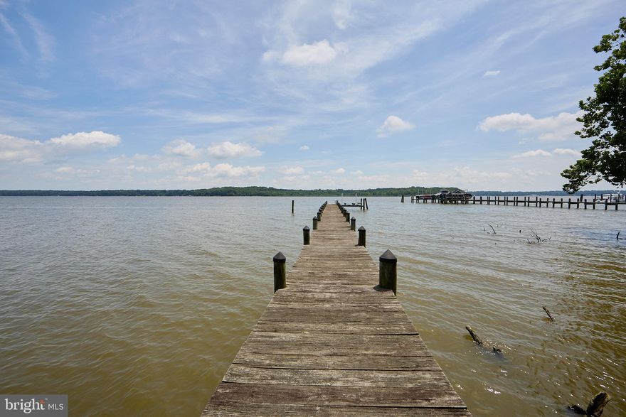 GREAT NEW PRICE!!! MOTIVATED SELLER ALERT!!!!   Location, Location, Location!
Welcome to your waterfront paradise—2.5 stunning acres on the Elk River with unmatched views and endless potential! Start your mornings with breathtaking sunrises from the deck, relax on your private beach at low tide, or head out on the water from your private dock—perfect for boating, jet skis, and exploring the Chesapeake Bay.  This 5-bedroom, 2-bath home offers a spacious open floor plan centered around a massive great room with floor-to-ceiling brick fireplace and panoramic river views. The primary suite features an en-suite bath and walk-in closet, while four additional bedrooms provide plenty of space for family or guests.  The lower level is unfinished, ready for your custom design. Two bookend garages frame the home, leading into a central walkout entertainment area—a rare and versatile layout.  This home needs your personal touch, but once complete, it will be a true masterpiece on the water.
Don't miss this once-in-a-lifetime opportunity to create your dream waterfront retreat!