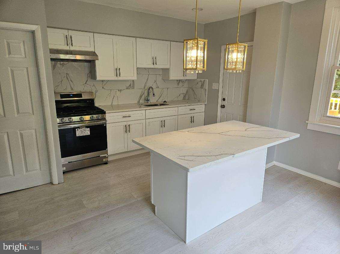 Welcome to this lovely, updated townhouse, perfectly nestled on a quiet cul-de-sac street. Enjoy effortless access to major highways and the airport. Step into the charm of this beautiful home, featuring a spacious front porch ideal for relaxing with family and friends. Inside, discover an open living and dining area, accompanied by a modern open kitchen. The kitchen boasts a large island, new appliances, beautiful crystal lighting & inside lighting and back door leading to an expansive deck – perfect for family summer BBQs. The second floor showcases three generously sized bedrooms and a fully updated bathroom. The whole house with new updated wood floor , New painted This new updated property is sold AS-IS. Don't miss this incredible opportunity! Schedule your tour today!