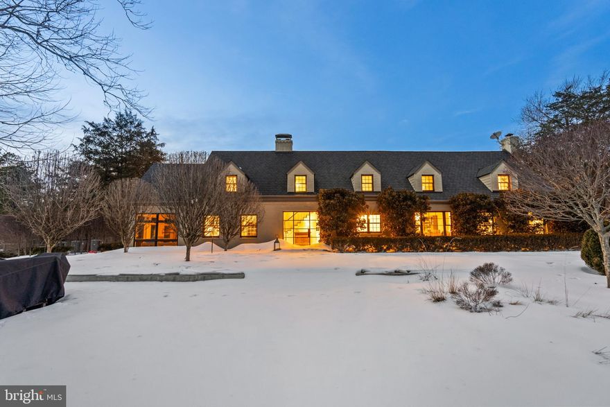 As featured in Home & Design Magazine, this gated residence sits on 3 private, fully-fenced acres, meticulously curated by Katia Goffin Gardens, and seamlessly merges farmhouse with contemporary - a true sanctuary only minutes from all the conveniences of Reston and major commuting arteries of NoVA. The expansion, lead by architect Stefan Schwarzkopf with Allied8, thoughtfully incorporated the original part of the home (The Vale Dairy Farmhouse, circa 1940), conveying a unique history and character with the property.

 ● The two-story foyer showcases floor-to-ceiling windows overlooking the heated saltwater pool, bluestone patio, ipe decking, and three fountains, bringing the outdoor living space into the home all four seasons. Accessible via the foyer mezzanine is one of the Primary Suites, showcasing hardwood floors (just refinished), two walk-in closets, a spacious en-suite bathroom, laundry closet, and built-in storage. The private balcony, accessible via the floor-to-ceiling window wall (with automated shades) overlooks the pool patio and rear of the property. This flexible suite has also functioned easily as additional living space or an office.

 ● The central foyer also leads to the original part of the home, including a beautiful, corner family room (expanded in 2021) with white oak floors & woodburning fireplace and the eat-in kitchen, featuring a luxury appliance package, breakfast bar on the cooking island (4 chair seating), abundant cabinet and counter space, butler’s pantry, coffee bar, and a dining table nook overlooking the Boxwood Garden. The rear of the main level includes a powder room, office, large closet, spacious living room (with another woodburning fireplace), a 210 SF sunroom overlooking the gardens, a large storage closet, and a staircase foyer to the upper level bedroom suites.

 ● Offering both flexibility and modern comfort in its bedroom layout, the additional 3 bedrooms (all of ample size) each feature an en-suite bathroom and copious closet space. NOTE: The current owners expanded the front bedroom, creating a large secondary Primary Suite. In addition to the utility room and an expanded kitchen/storage area, the walk-up basement also features a large hobby room or storage room with a substantial center island.

 ● The extensive $1M landscaping investment significantly elevates this pristine property, creating two beautiful gardens while leaving expansive, rolling hills with a bucolic view on the rear of the property. At this point, the trees and shrubbery are lush and mature after years of meticulous maintenance and attention and an underground drainage system has ultimately perfected the function of the Boxwood Garden.

 ● Additional features of this home include: 4-car garage + motorcourt for 6+ additional cars, wine room, custom Lutron lighting package (interior & exterior), heated flooring, outdoor kitchen, two manicured gardens, fully-fenced perimeter with two electric gates (incl. secondary “service” entrance), large storage shed, and plentiful natural light through modern windows throughout. 

 ● All systems have been carefully maintained and just serviced prior to listing, including the septic system (with two tanks), the well-water treatment system, the 37-zone irrigation system, two wood-burning fireplaces, the generator, and the saltwater pool. The current owners have recently replaced 3 of the 4 HVAC systems and installed a new hot water heater. **NOTE: the 6,244 Total Estimated SF does NOT include the  780 SF 4-car garage.

 ● This unique home, brimming with historic charm and contemporary character, is moments from all the conveniences of Reston and Northern Virginia, including Reston Metro only 3.5 miles away. The property backs to miles of connected trails (Difficult Run) and is under 15 minutes to Dulles Airport and central (< 10 mins) to Fair Oaks, Reston, and Oakton.