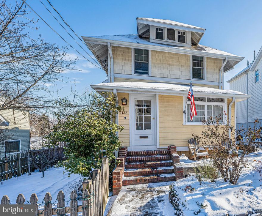 Discover exceptional space and family-friendly living in the sought-after Cherrydale neighborhood of Arlington. This cherished Craftsman Home offers quick access to downtown DC and the GW Parkway, and a peaceful respite in a beautiful leafy setting with a park across the street, one block from grocery, hardware, restaurants, yoga, fly fishing, framing and flower shops; nestled in one of Arlington’s most desirable school pyramids. In a delightful, welcoming community with wonderful neighbors, less than a mile from elementary, middle, and high schools, this lovely home is just a short hop to Potomac River sailing, boating, hiking, tennis, and golf. The property is part of the original cherry orchard that gave Cherrydale its name. Its close proximity to Georgetown, Smithsonian museums, national memorials, Reagan National and Dulles airports, Metro and bus, and vibrant bike path system makes it an ideal location for variable work and family situations. This beautifully expanded Arlington home features a three-level addition, offering the perfect blend of space, style, and functionality. Step inside to find original hardwood floors leading to inviting spaces for reading, gathering, working, arts and crafts, games, and culminating in an open floor plan on the main level of the addition. Seamlessly blending the spectacular chef’s kitchen and marble countertops, is the beautiful hand-crafted bar, custom-built craftsman fireplace mantle, gas fireplace, and family space for optimal gatherings. Upstairs, the owner’s spa-like suite boasts cathedral ceilings, abundant natural light, incredible tree-top views with a tree-house feel, spacious en-suite bath with double sinks and dual shower-heads, and a large custom-built walk-in closet with a snug window seat offering an unexpected retreat. The second floor also leads to an insulated finished attic storage space with pull-down stair access. Three additional bedrooms on the second floor include versatility and flexible rooms for guests, expanding families, office space, or sunny exercise space. Heading down to the finished basement, a cozy bedroom awaits, easily converted to a family theatre or media center, leading to a spacious light-filled room with windows on three sides that open to the private backyard. This incredible space with sunlight streaming in, offers endless possibilities as a living area, game room, maker-space, fitness space, wood-working, home office, plant nursery, kids’ activity room, in-law suite, guest quarters, or Airbnb. This home also features dual-zone HVAC systems for optimal comfort, a driveway that accommodates two cars, additional street parking for guests, and two garden sheds surrounded by mature landscaping and green space which offers delightful possibilities for green thumbs. Fruiting fig and cherry trees offer an abundant harvest, along with camellias, hydrangeas, roses, viburnum, holly trees, a vegetable garden, plus an herb and flower garden for body and soul. An outdoor chiminea area with Adirondack chairs provides a relaxing place for gatherings with friends and family, and space for wondrous night-time sky star-gazing. Come see the possibilities and envision your chance to own this charming and thoughtfully-designed home.