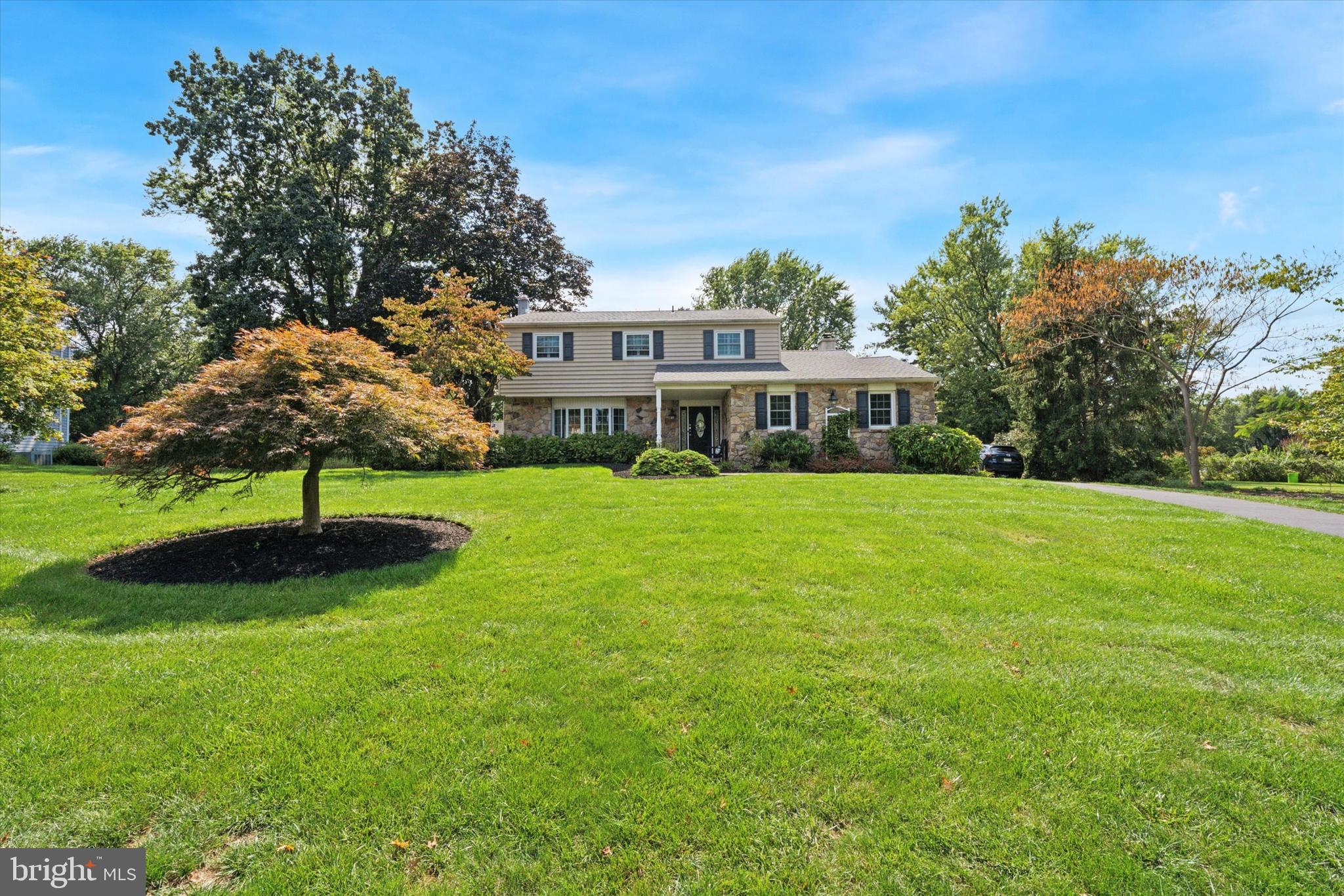 Situated on a premium ¾ acre lot, this beautifully maintained and thoughtfully updated home offers elegance, comfort, and modern conveniences. Step inside to discover rich hardwood floors that flow throughout the first floor, setting the tone for the home’s exceptional craftsmanship. Custom millwork, including crown molding, chair rail, and wainscoting, adds timeless character and charm to every room. The updated kitchen, features granite countertops, solid wood cabinetry, and high-end stainless steel appliances, including a Dacor gas cooktop and built-in microwave/convection oven. Adjacent to the kitchen, the family room boasts a stone-surround gas fireplace, custom built-ins, and bookshelves—perfect for cozy evenings or entertaining guests. A stunning four-season room, bathed in natural light from skylights and walls of windows, offers panoramic views of the expansive, private backyard. It’s an ideal space for relaxing mornings, afternoon reading, or evening gatherings. The first floor also includes a spacious formal living room and dining room, both with large bay windows, as well as an updated powder room and a mudroom with direct access to the two-car garage. Upstairs, you’ll find 4 generously sized bedrooms, all with walk-in closets. The main bedroom features an updated ensuite bathroom with a dual vanity and large ceramic tile shower. The 2nd full bathroom features a large jetted-tub and separate shower stall. The finished basement adds versatile living space, including a recreation room and a separate home office with built-in desk and cabinetry, perfect for today’s work-from-home lifestyle. Outdoors, the wide-open backyard provides plenty of room to play, garden, or entertain. Enjoy summer barbecues on the 13x23 paver patio, and take advantage of the 15x22 shed with concrete floor, electric and ramp for additional storage or workshop space. Additional highlights include a Whole-house gas-powered backup generator, Updated 3-zone heating and cooling systems, Newer roof , Updated windows throughout and a Recently sealed, oversized driveway. This is a rare opportunity to own a truly move-in-ready home in a prime location. Schedule your private tour today! (Floor plans and map of property available in documents tab)