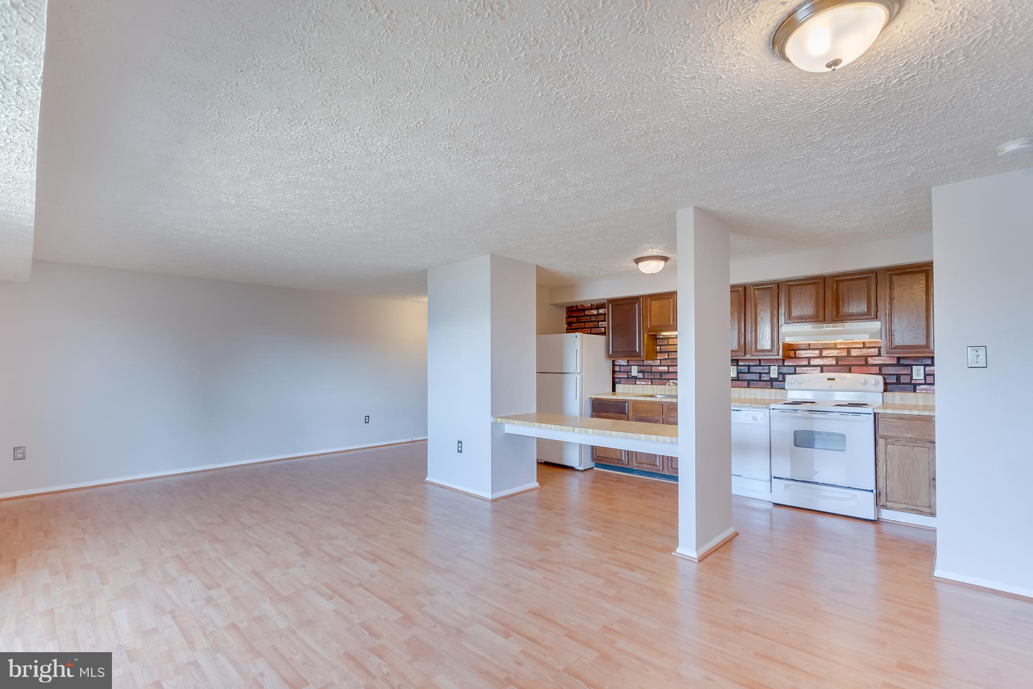 Sun filled and Spacious Top level 2 bedroom/2 bathroom condo in Germantown. Open concept condo unit. Tree line views off of the balcony. Fantastic INVESTMENT property. Seller has had consistent tenants. Condo is not FHA approved. 2 permitted parking spaces available for $50 each one-time fee. Plenty of guest parking.