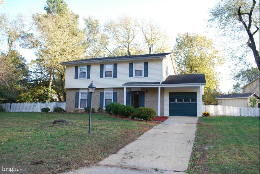 Amazing 4 bedroom 2.5 bath Colonial with front porch and one car garage. Sits back off a cul de sac and has a White Picket Fence. Backs to trees and has a HUGE backyard. All new paint and carpet.  All of the bedrooms are HUGE. Has tiled kitchen floor. Separate Living room, dining room and Family room. Large Country kitchen with breakfast bar. Don't miss this amazing home,