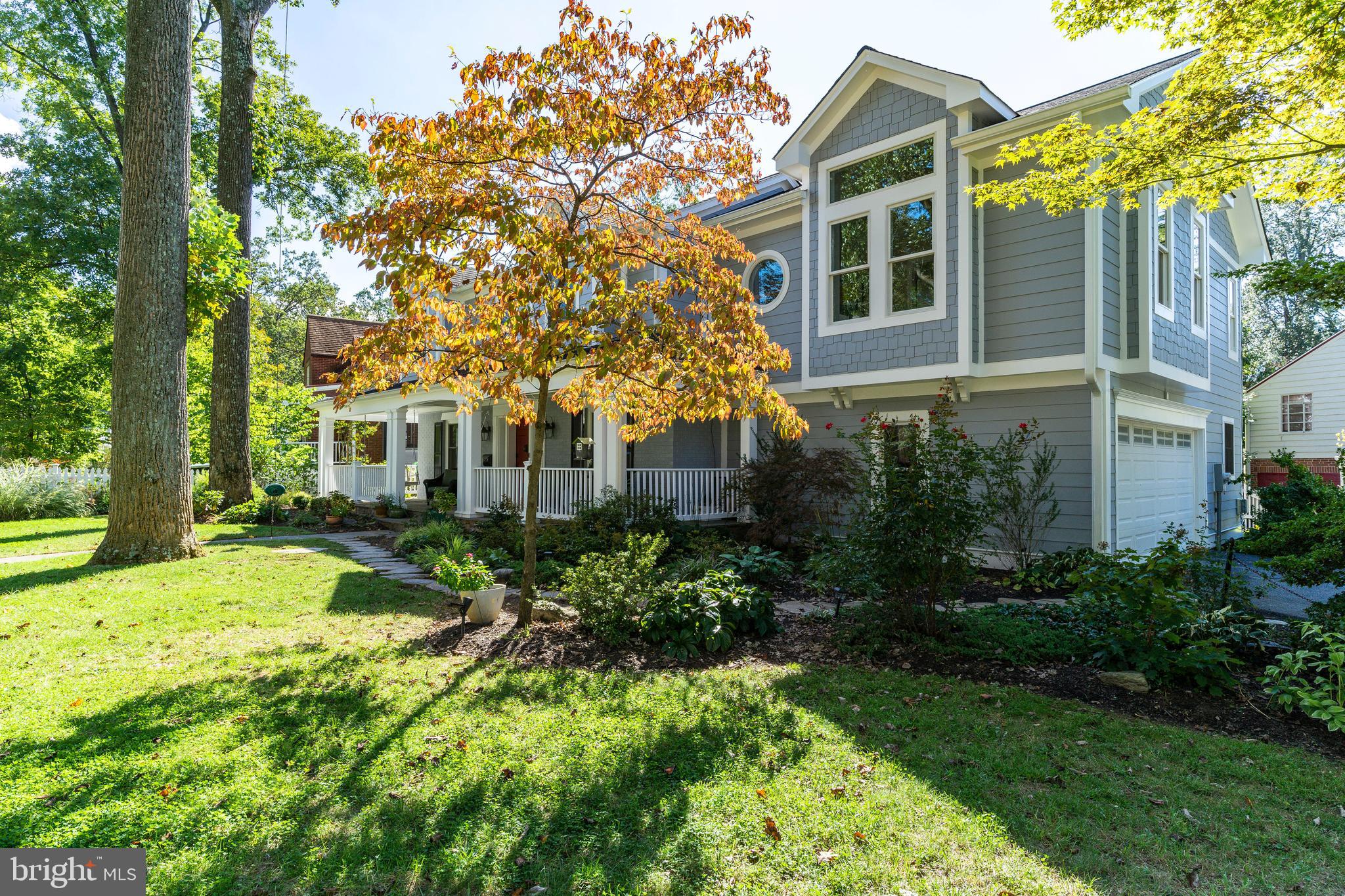 Located in Greenwich Forest, just a mile to downtown Bethesda, the house is sited on a beautiful 8,300 SF corner lot, short walk to NIH, and steps to Greenwich Forest Park. Major renovations have transformed the property, including exterior and interior reconstruction, designed by Georgetown architect John Katinas and built by homebuilder Chris Conlan. A welcoming wrap-around front porch addition overlooking a large flat front yard with mature trees and extensive landscaping. A 2014 overhaul renovation of the main floor included an open Kitchen w peninsula bar and a sunny breakfast nook, Family-Room with wood burning fireplace and custom built-ins, formal Dining-Room and a large Living Room. Completing the main level are Mud-room with custom built-ins, Powder Room and a large 2 car garage. Upper floor includes four bedrooms and three full baths including new 2020 addition/renovation of a luxurious Owner's Suite with a private deck, dual walk-in closets, a Gallery, and a custom-built modern Home Office, light-filled, sunny and happy! Three additional bedrooms all with custom closets, and two renovated bathrooms. Fully finished walk-up basement consists of a guest suite with a kitchenette. Private and beautifully landscaped back patio perfect for entertaining large parties or for chilling with loved ones.